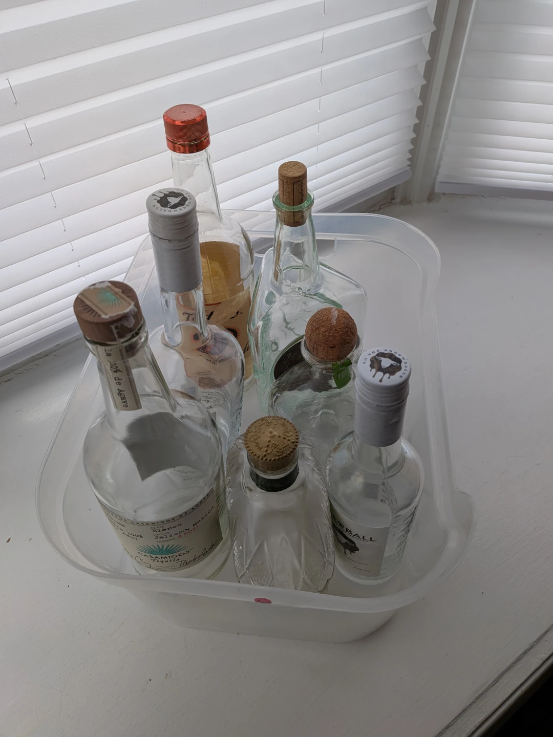 Assorted Empty Glass Bottles and Corks