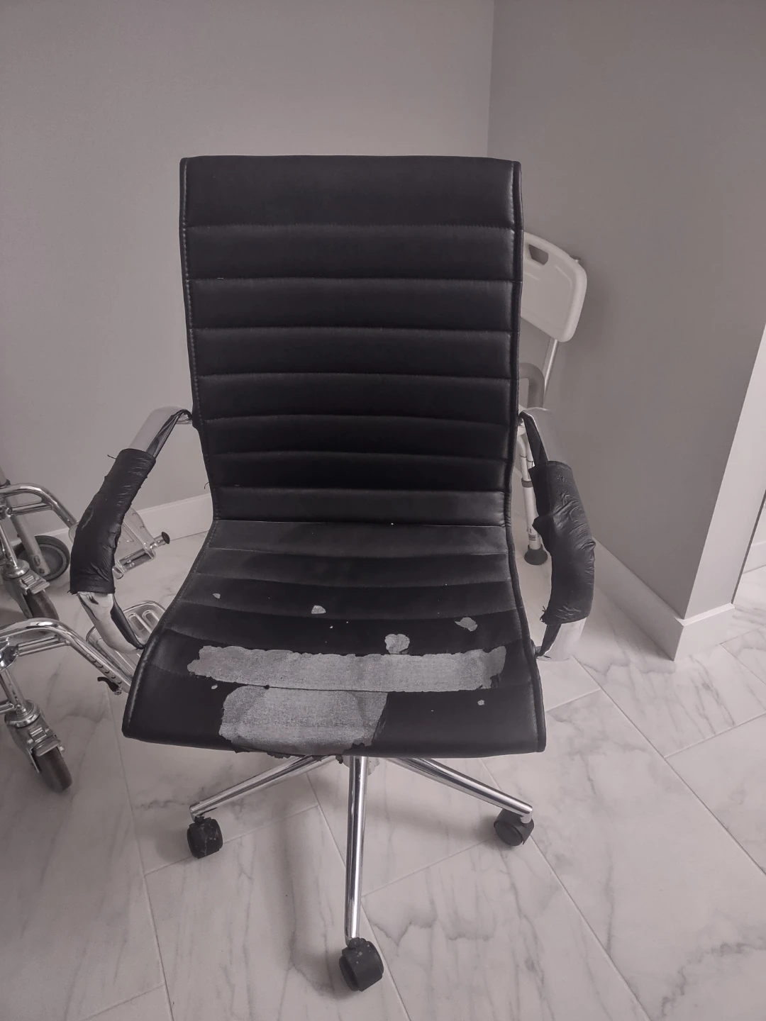 Black office chair with wear