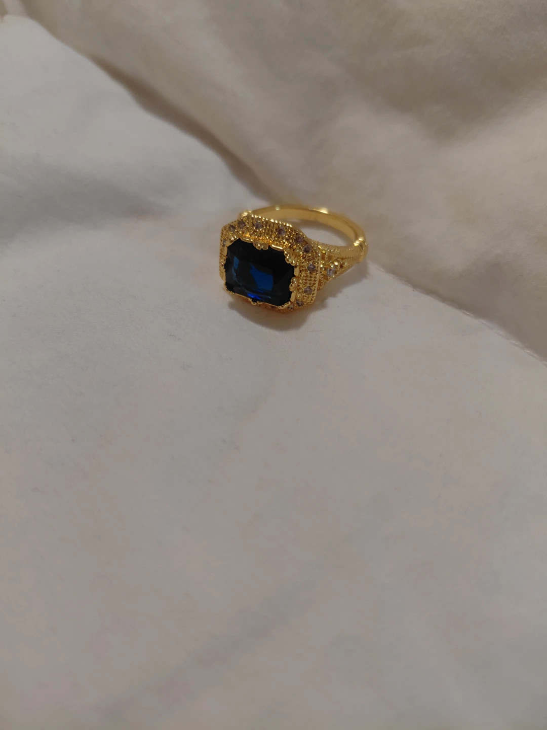 Gold-toned statement ring with dark blue stone - photo 3