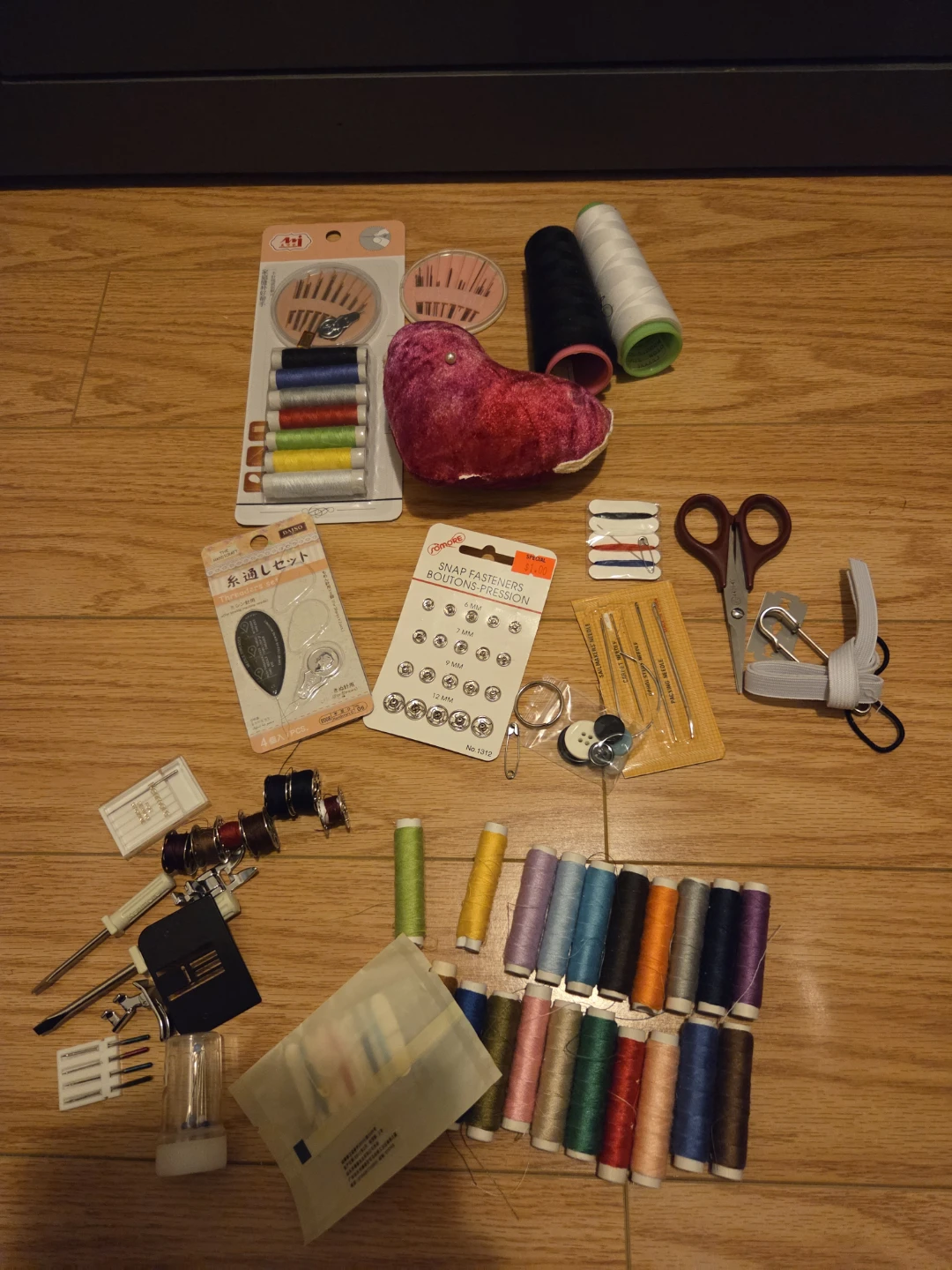Sewing kit with needles, bobbins and spool
