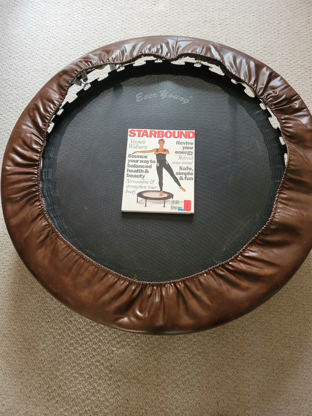Rebounder fitness trampoline with exercise book
