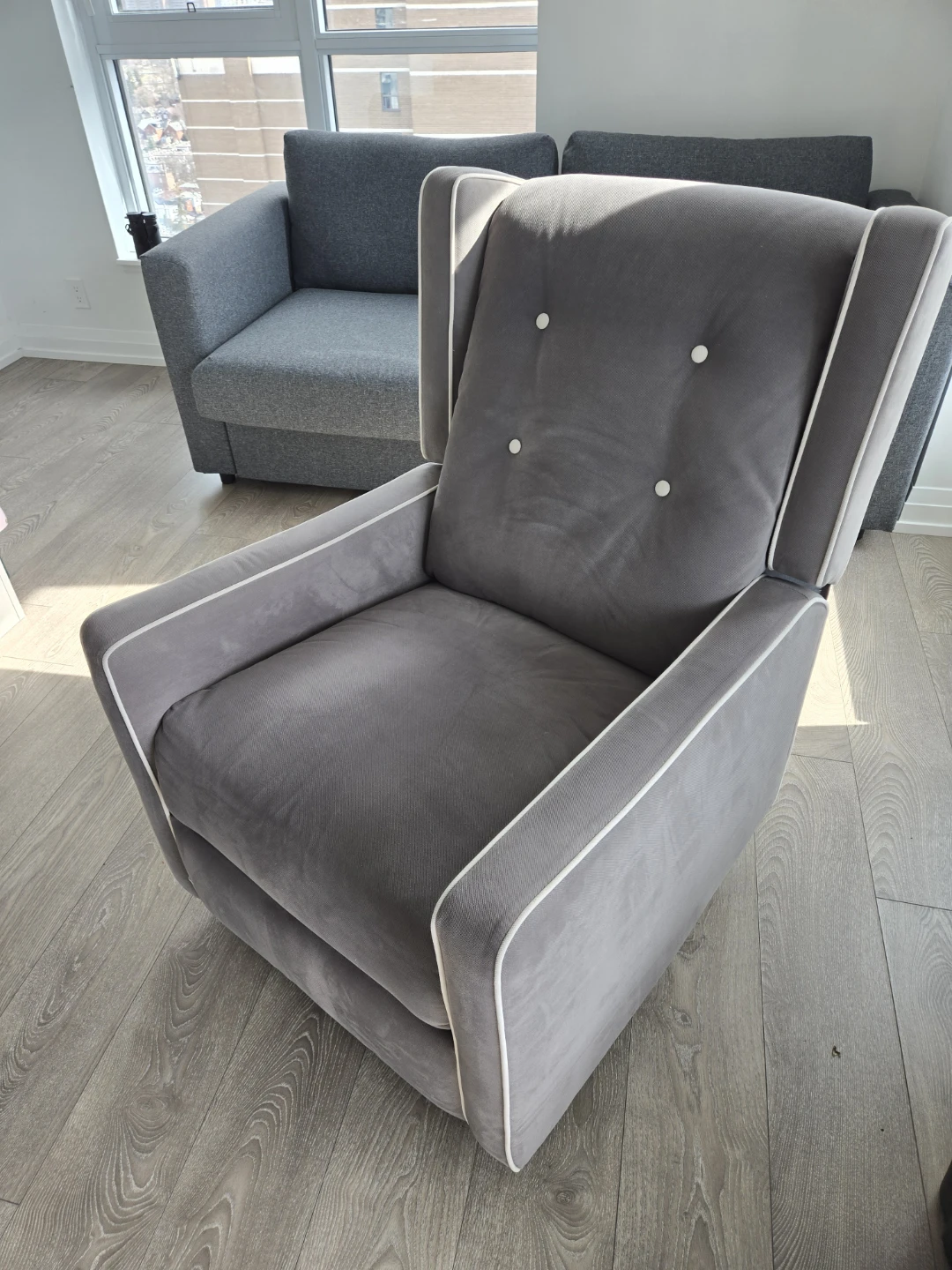 Grey Recliner Chair with White Piping