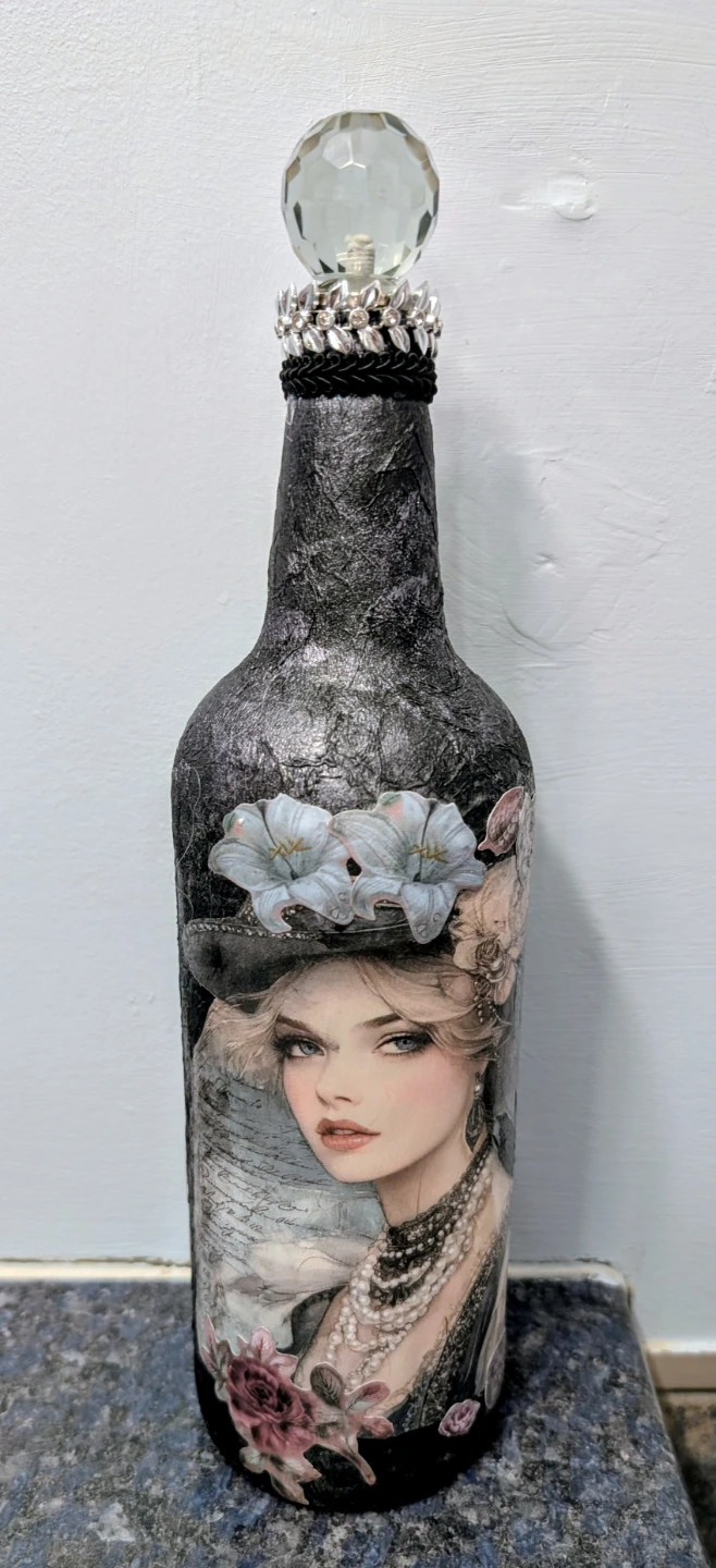 Art altered glass bottle with vintage lady motif