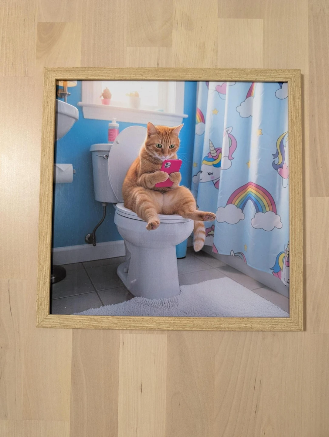 Framed Print: Cat on Toilet with Phone, with wooden frame