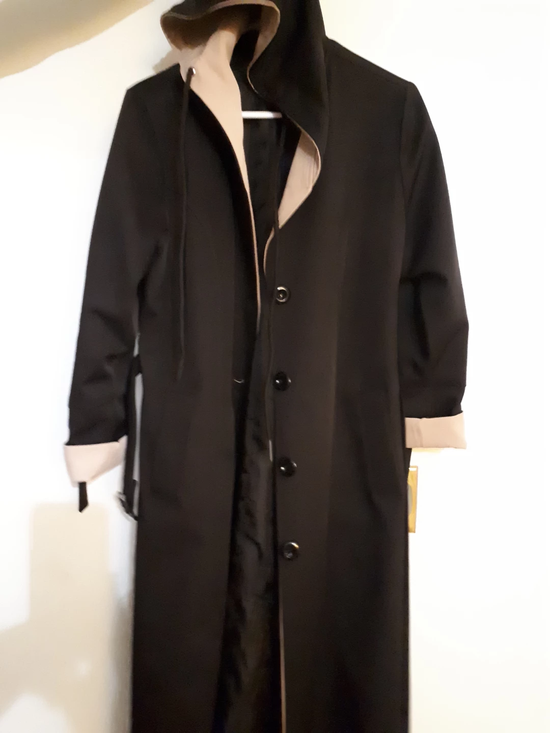 Black hooded trench coat with tan lining