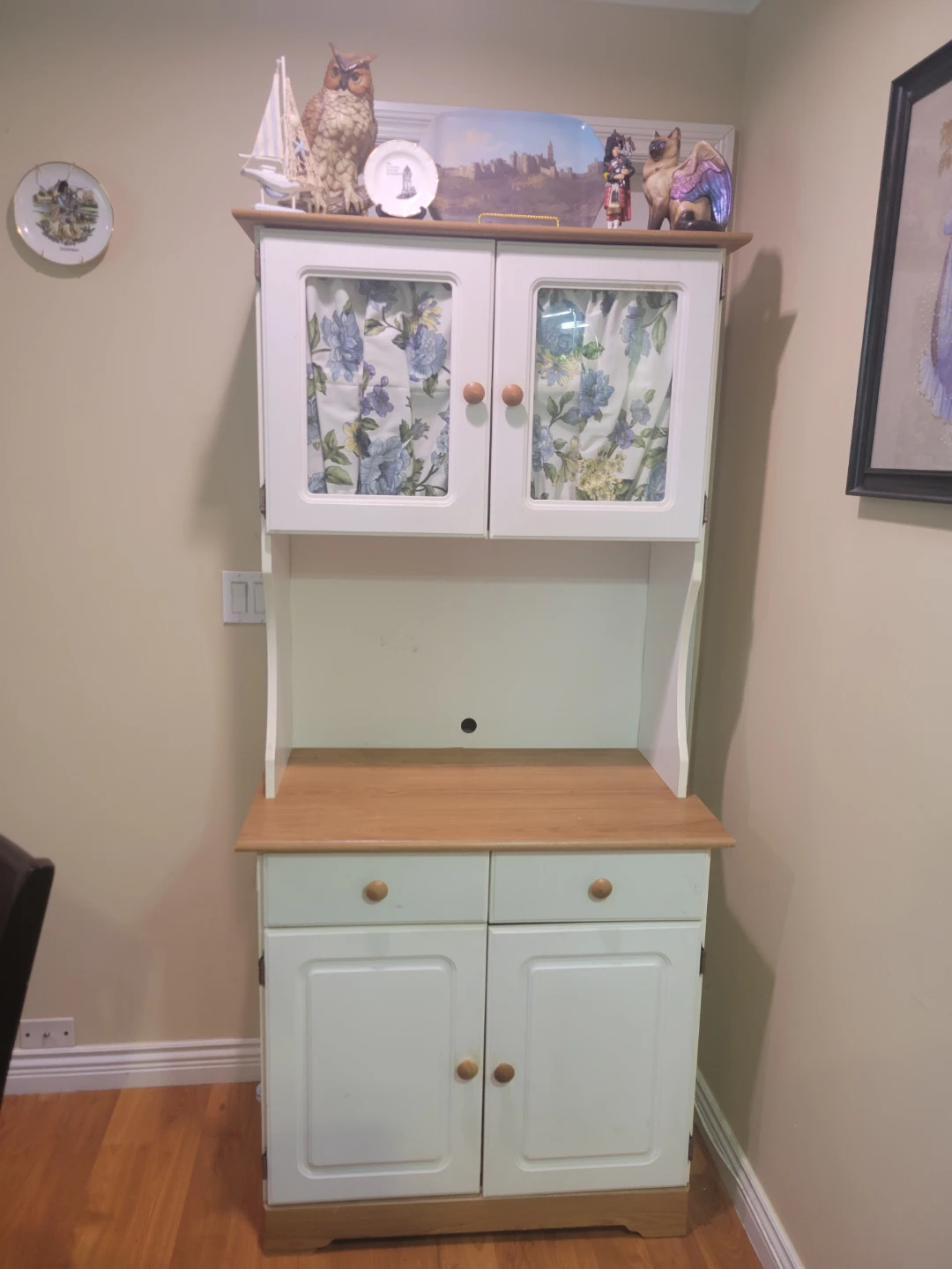 White microwave pantrywith Wooden Accents
