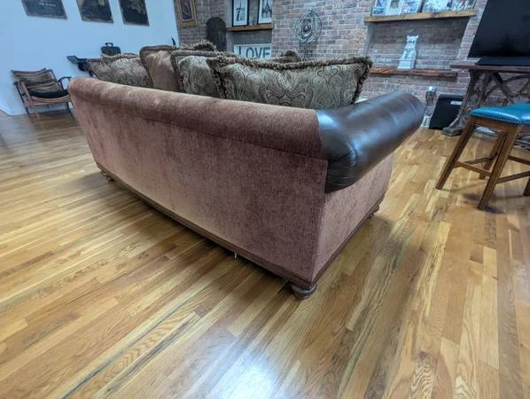 Brown Leather Chesterfield Sofa with Decorative Pillows