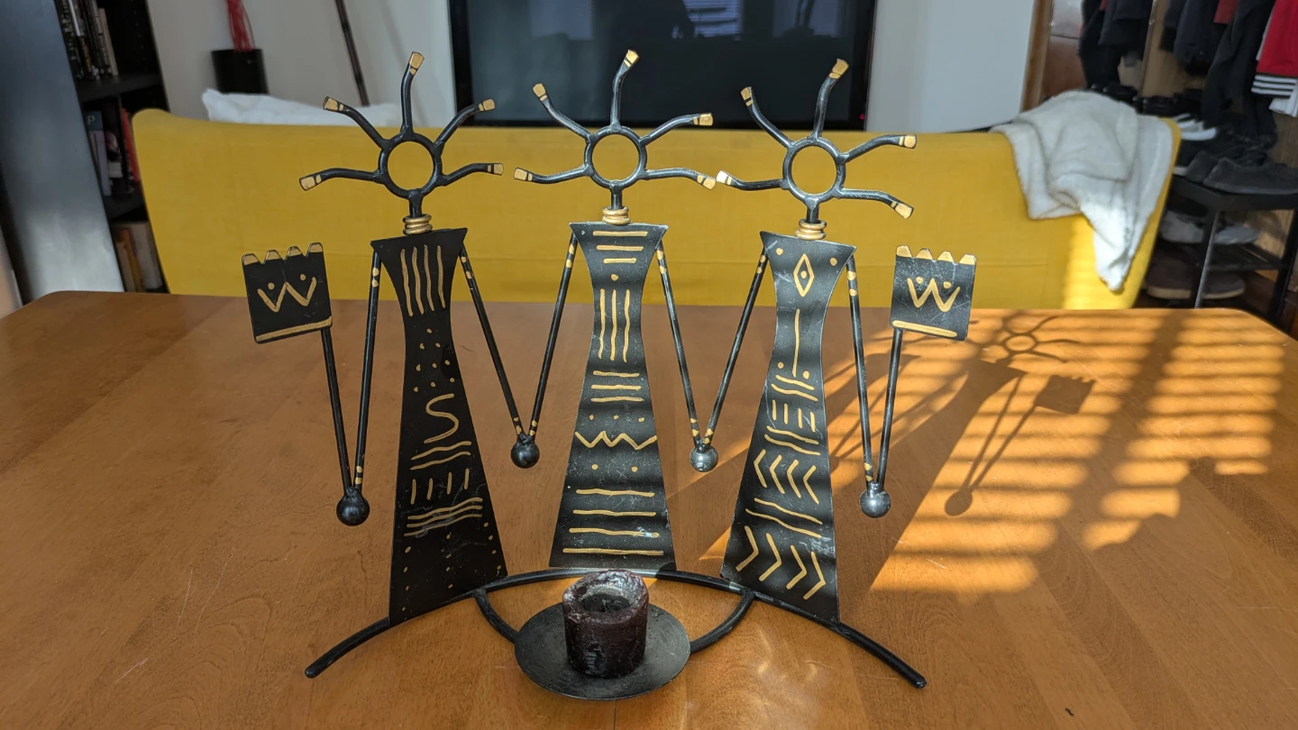 Black Metal Figurine Candle Holder with gold Accents
