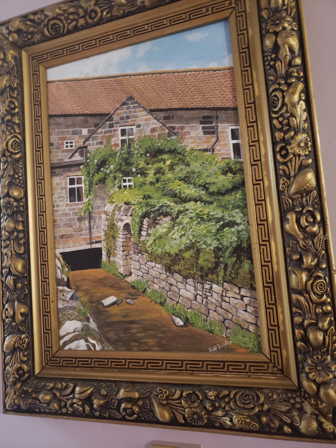 Framed Painting of a Stone House with Vines