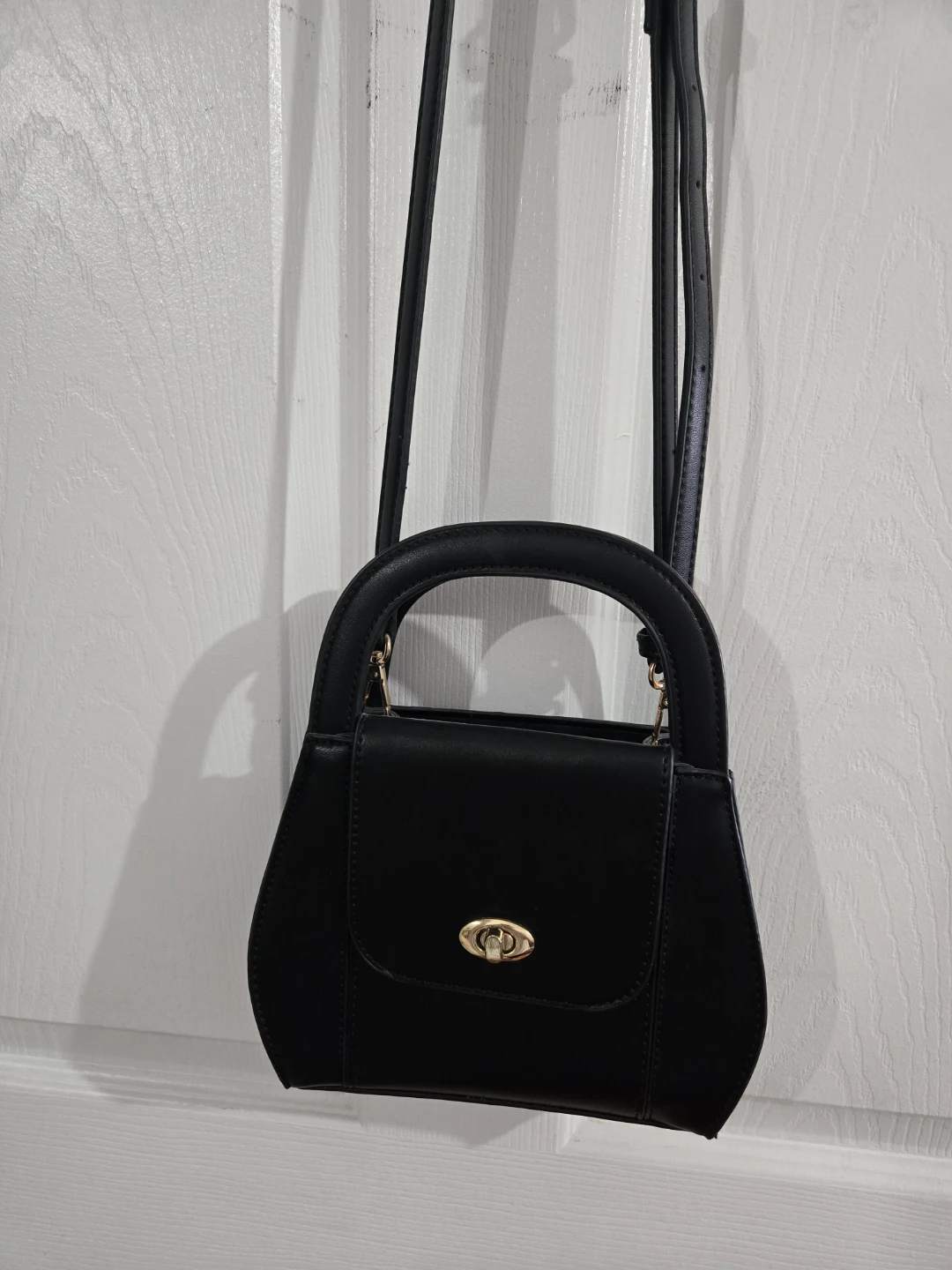 Black top-handle handbag