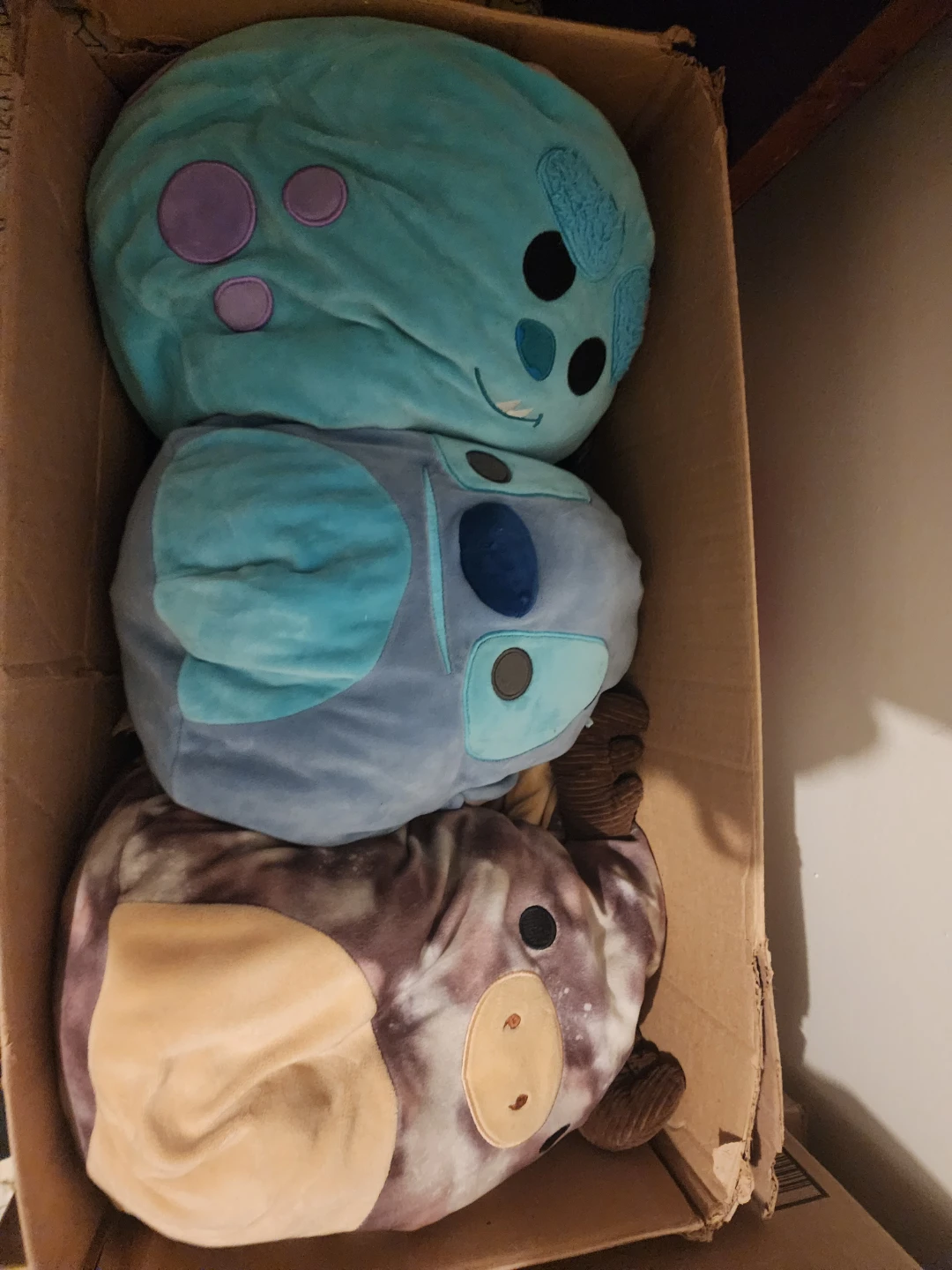 Three plush stuffed animals