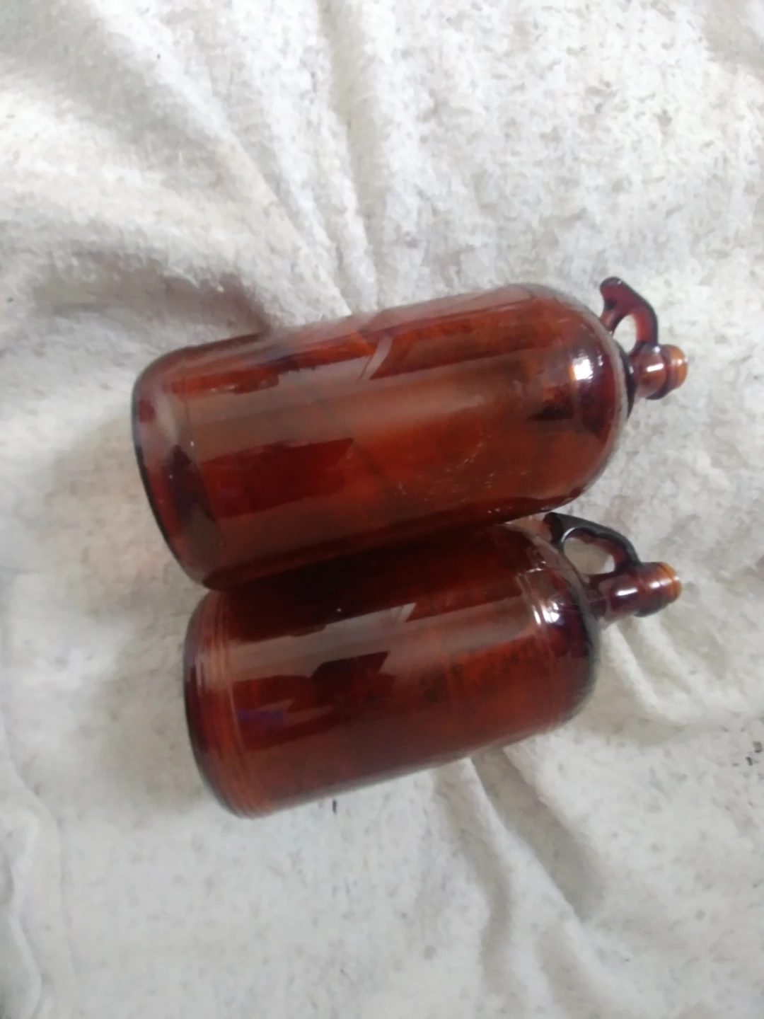 Two antique Javex Glass Jugs with Handles