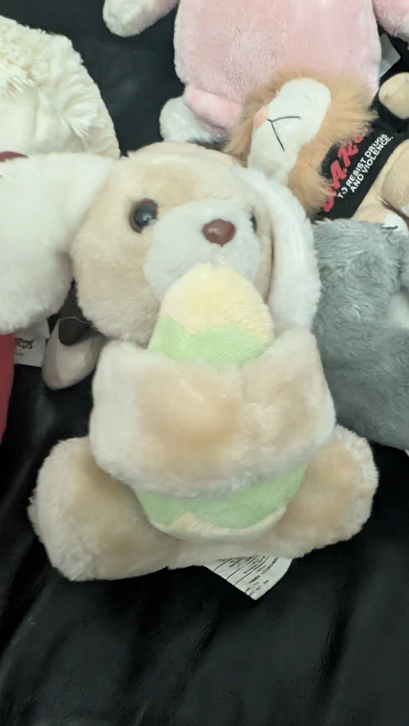 Plush Dog Holding Easter Egg