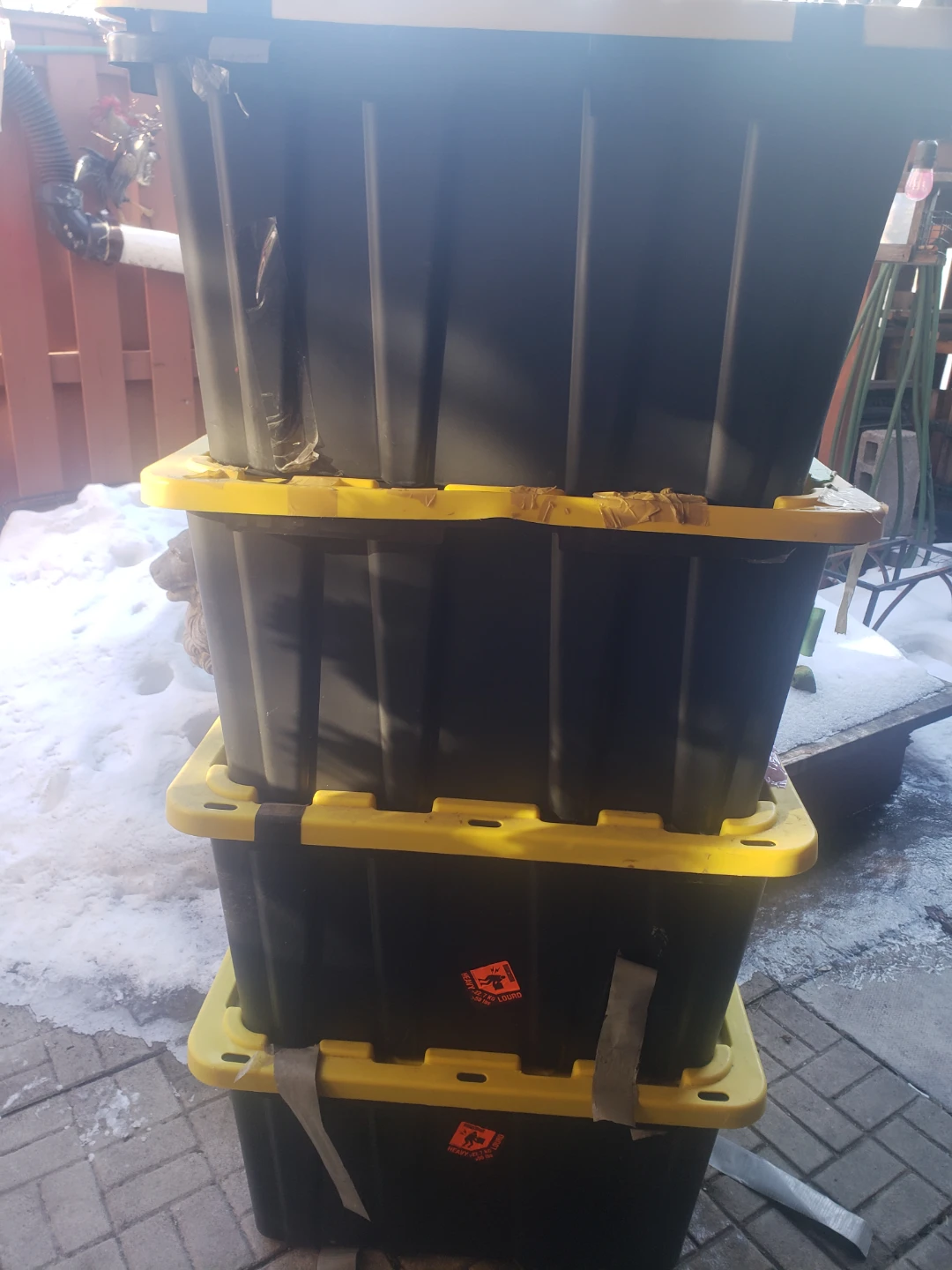 Stack of 4 Black Storage Totes with Yellow Lids