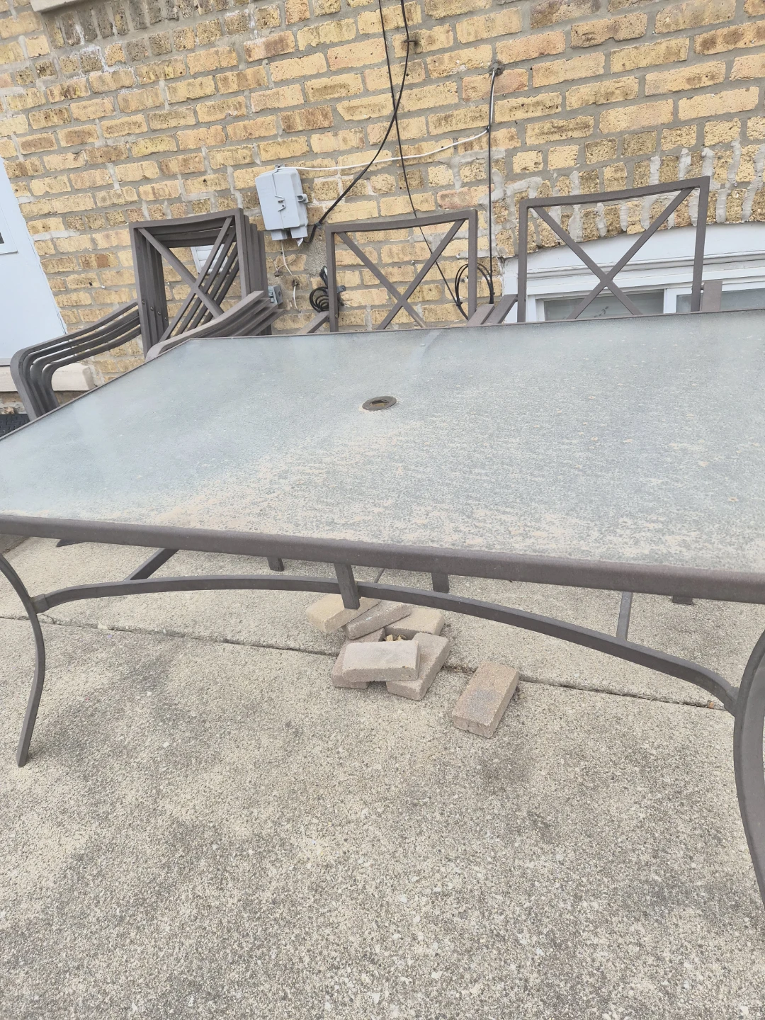 Glass Top Patio Table with Metal Frame. Chair Cushions included