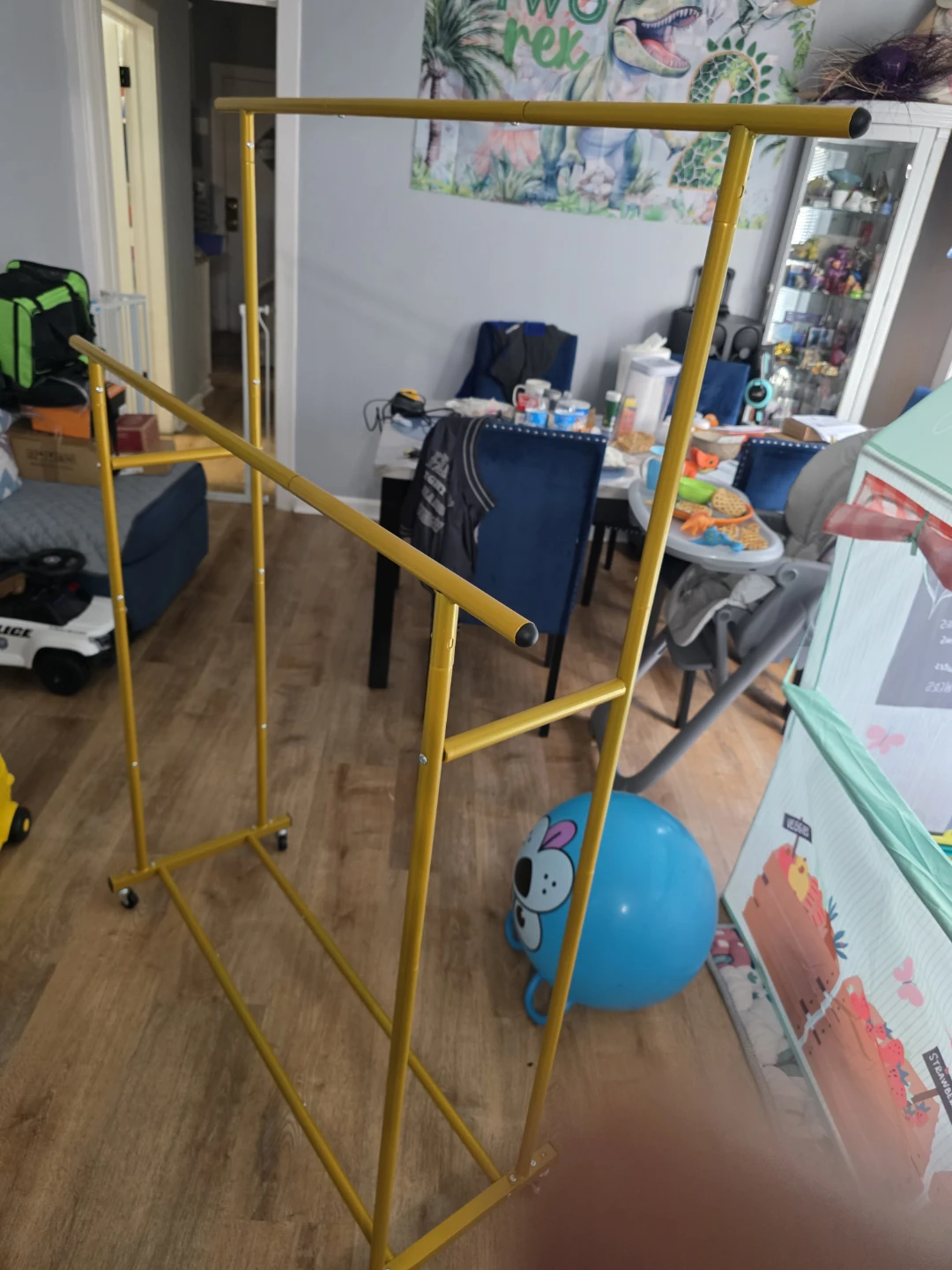 Yellow Metal Garment Rack on Wheels