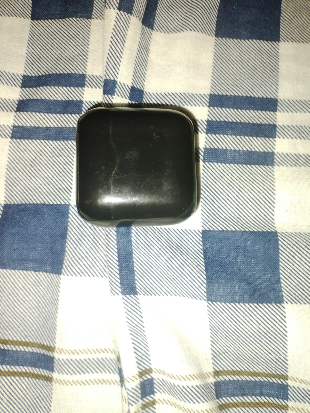 Black wireless earbuds charging case