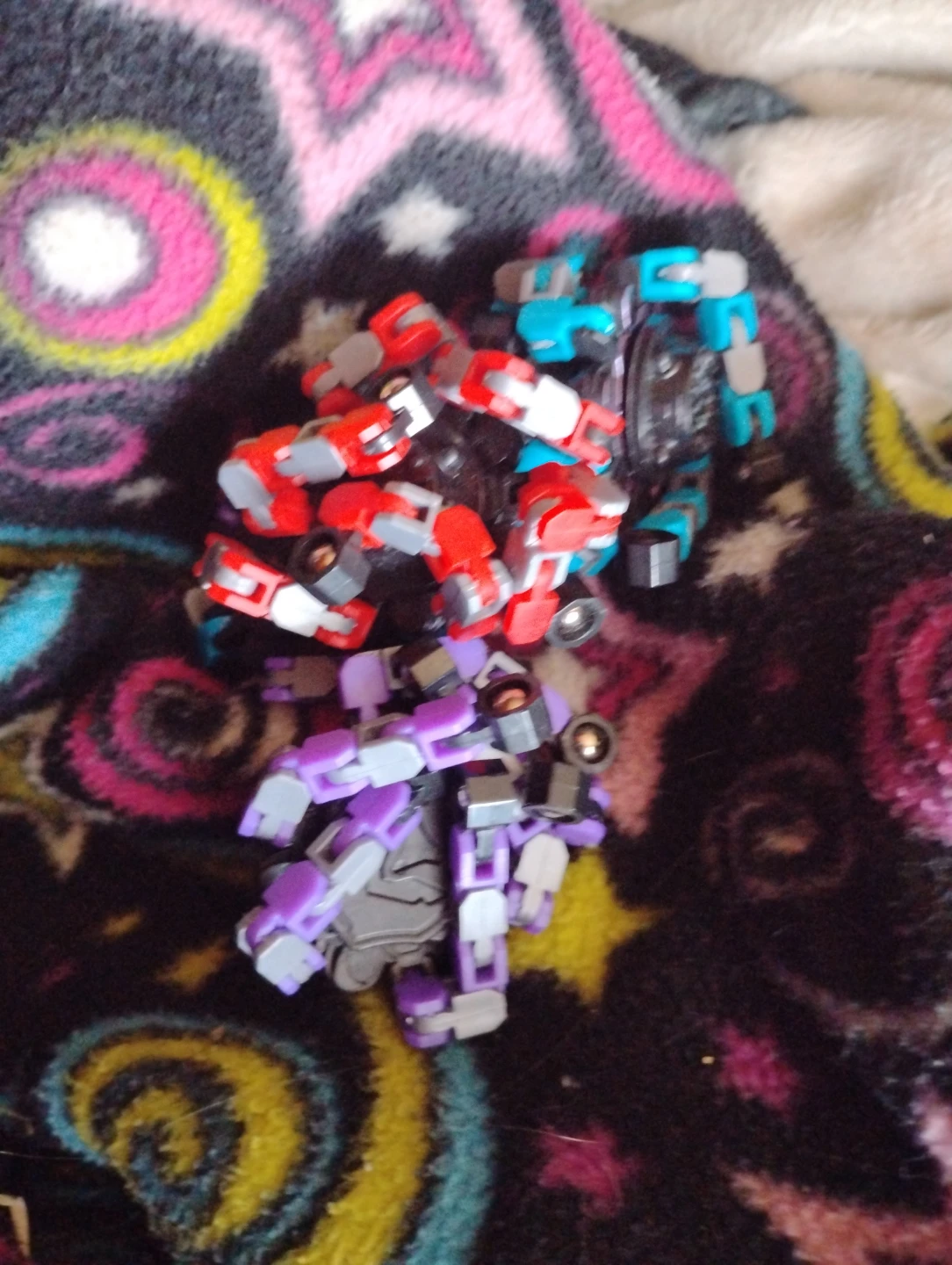 Bundle of Action Figures - Red, Blue, and Purple