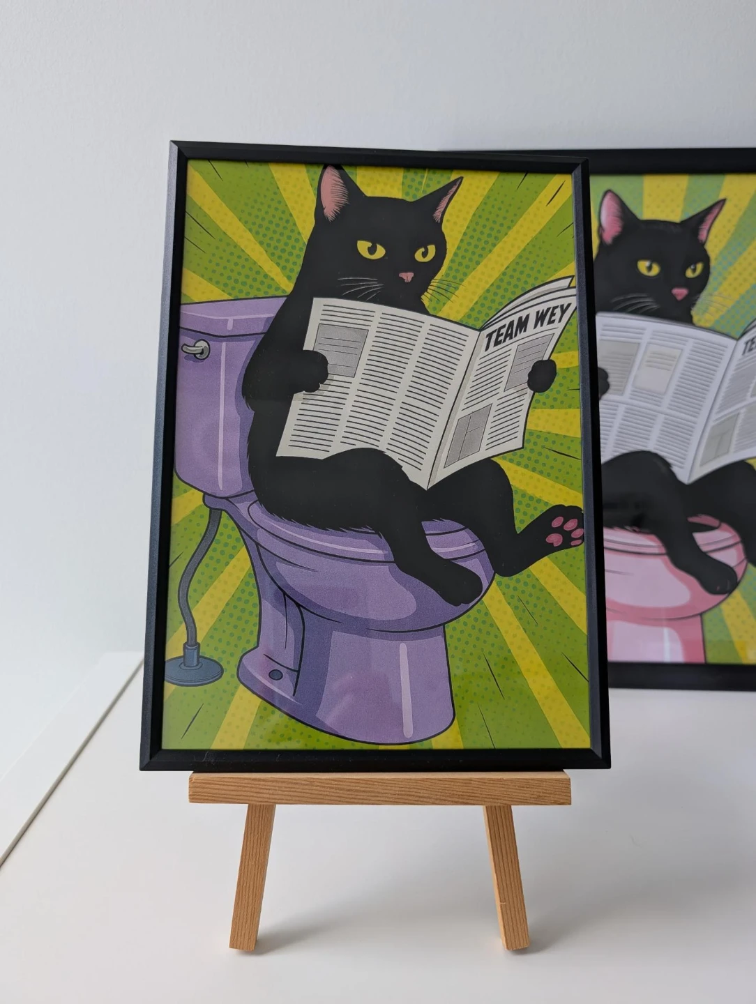 Framed Art Print - Black Cat on Toilet Reading Newspaper