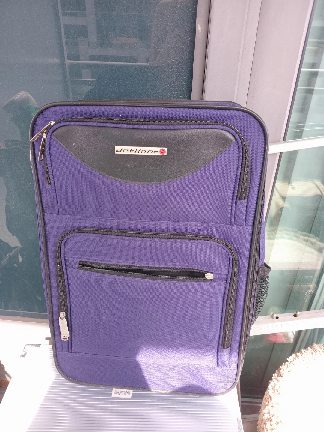 Jetliner Purple Rolling Suitcase