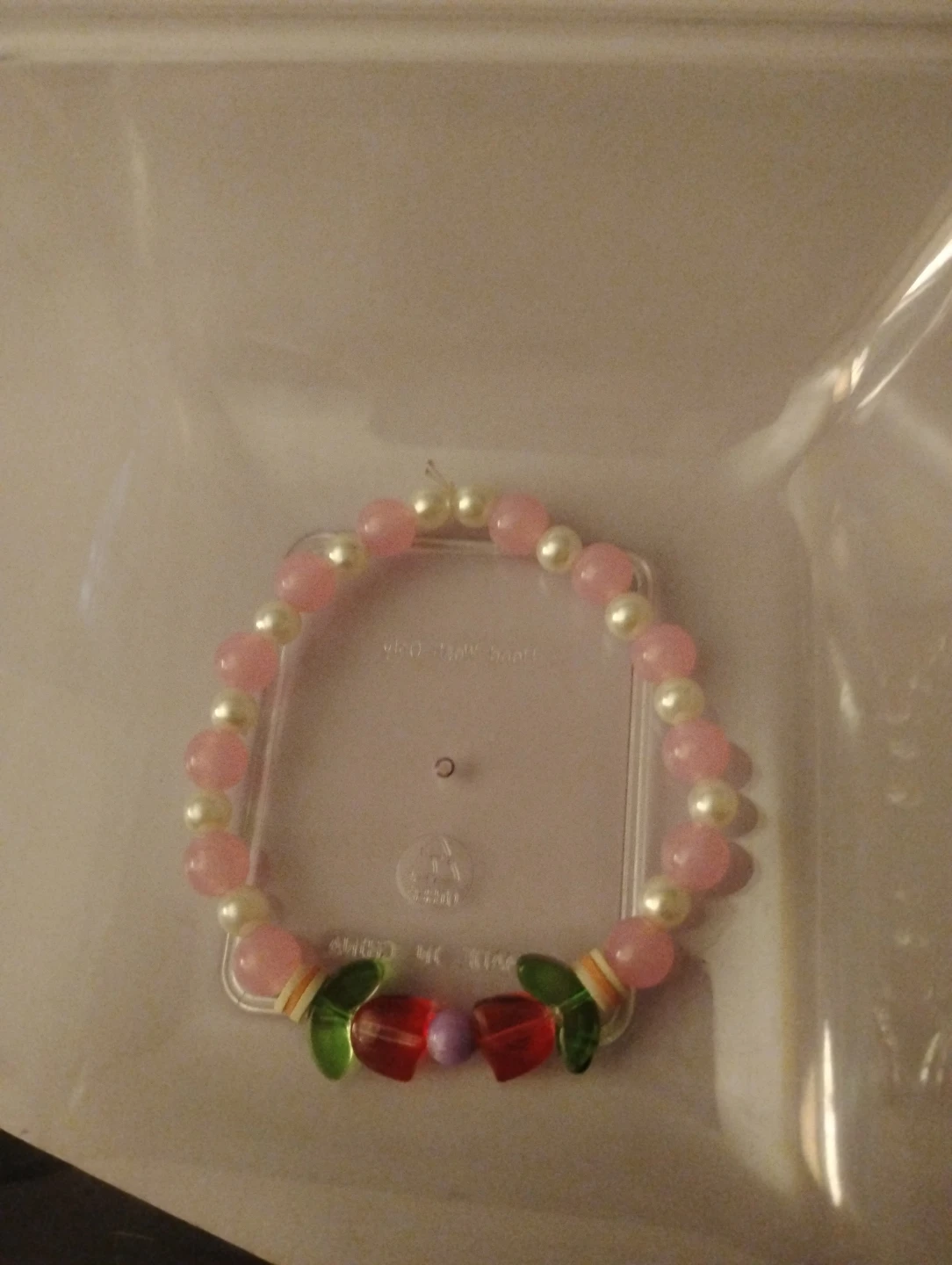 Pink and White Beaded Bracelet with Charms