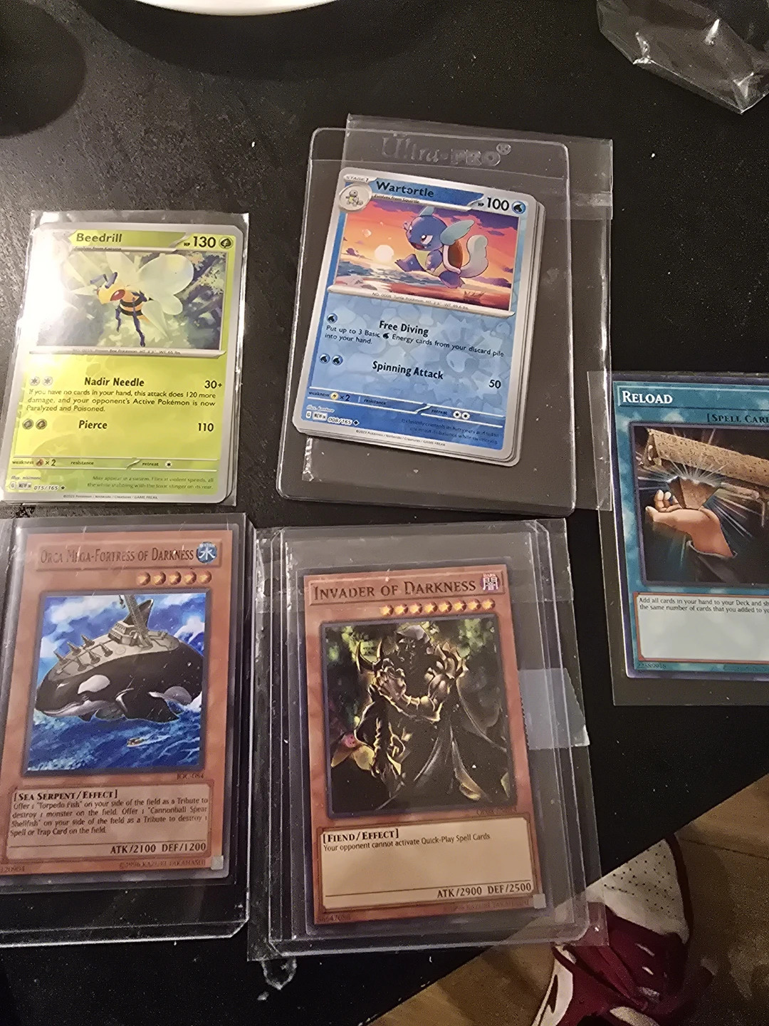 Collection of Pokemon and Yu-Gi-Oh! Trading Cards