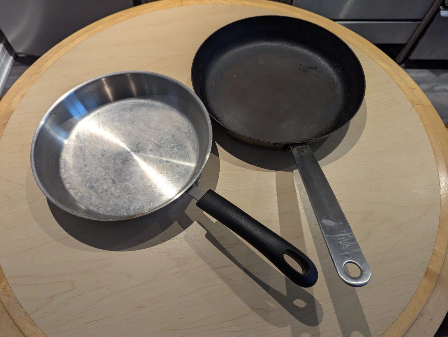 Two Frying Pans - Stainless Steel and Black