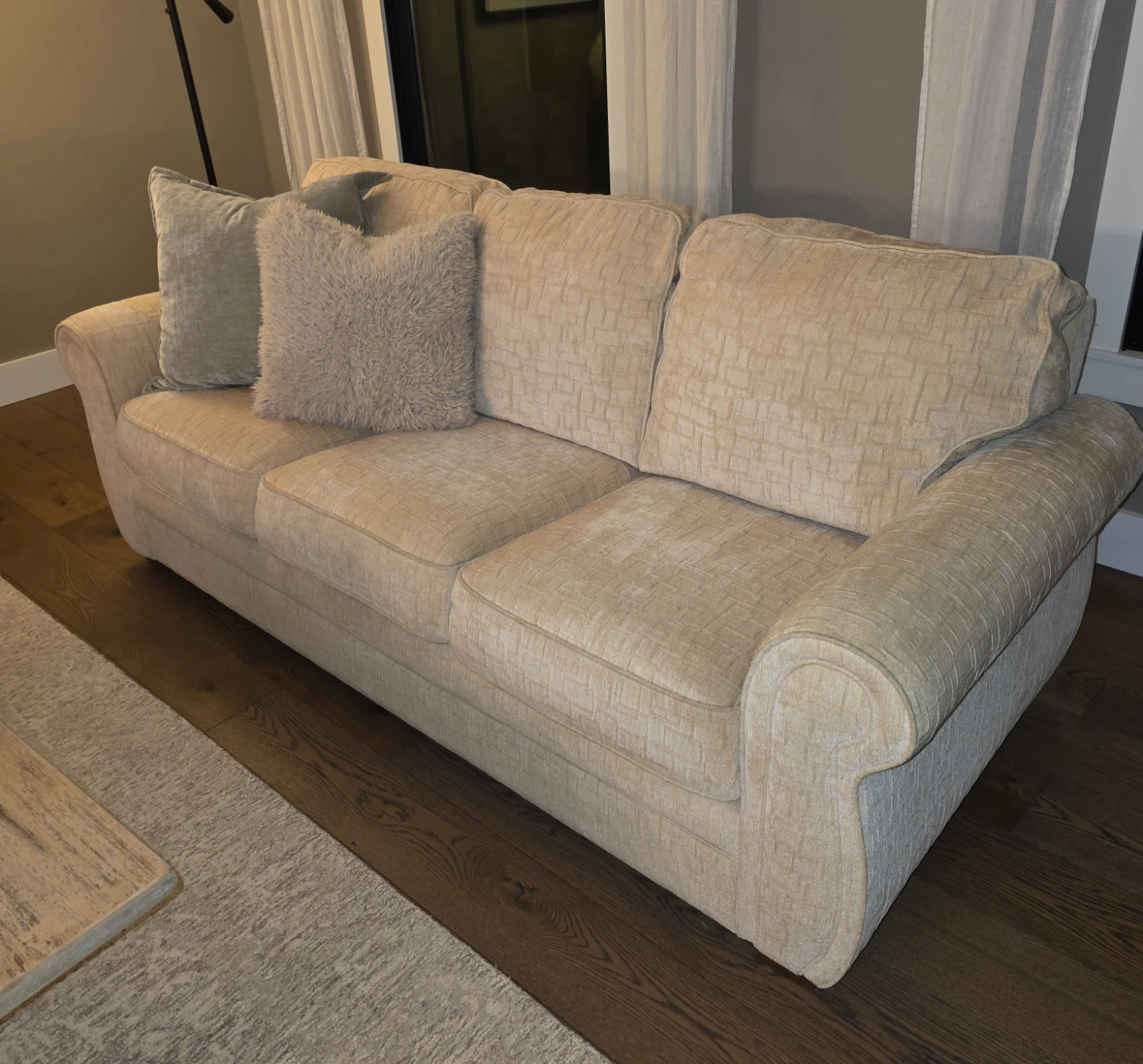 Cream Textured Sofa with Plush Pillows
