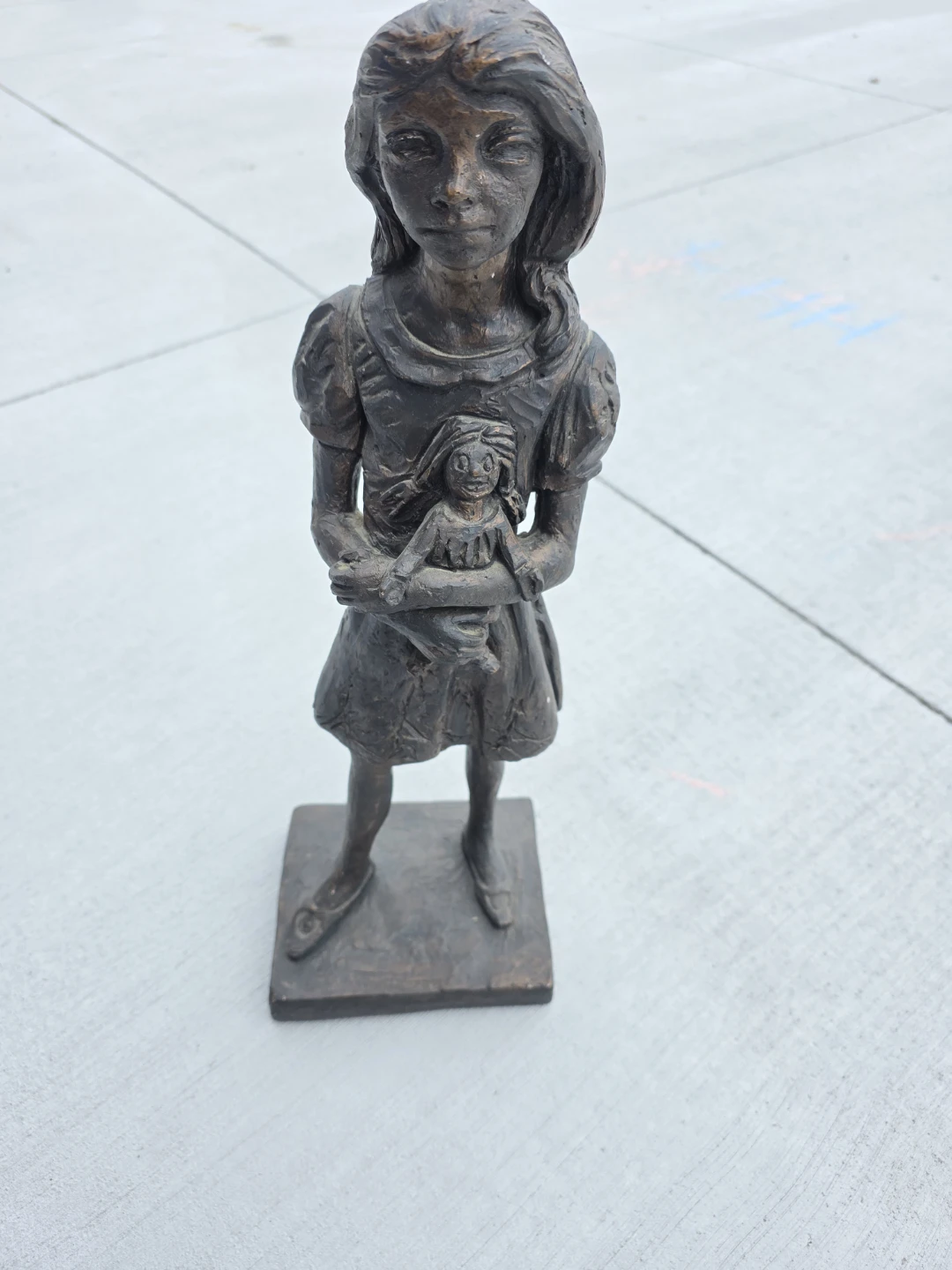 Bronze Statue of Girl Holding Doll - Made in Canada