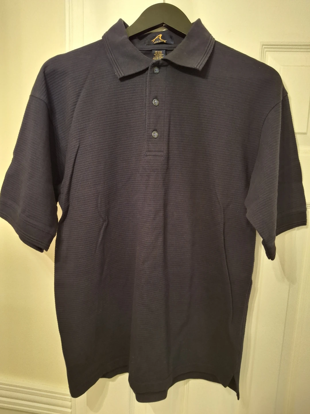 Mens navy golf shirt.