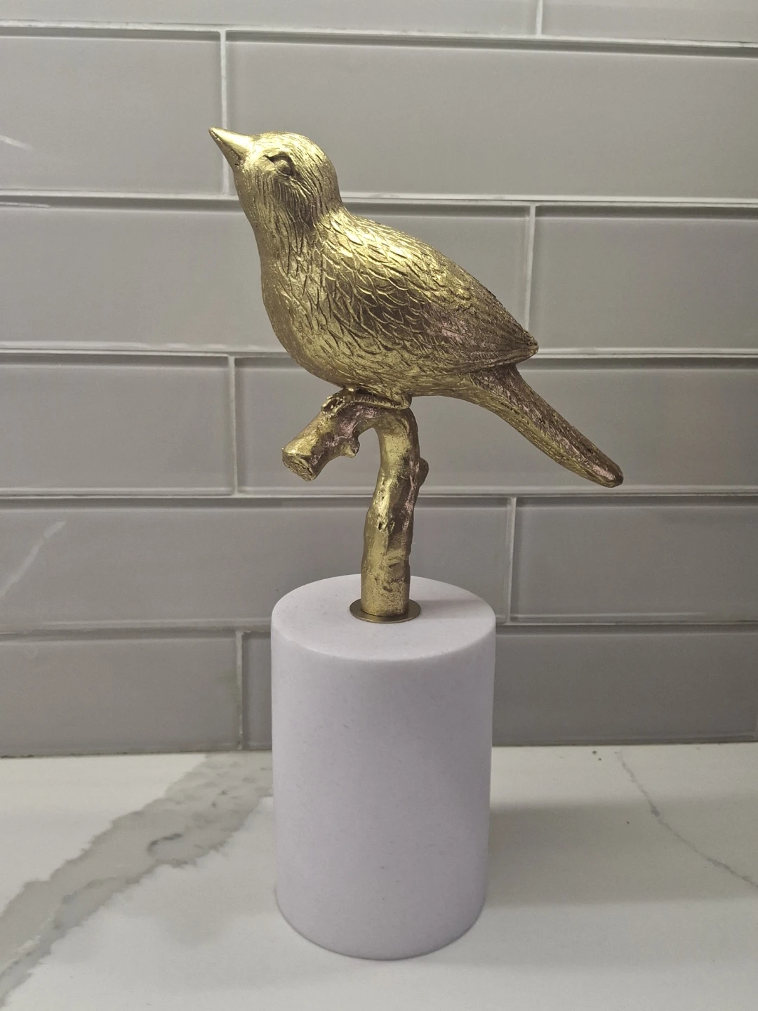 Gold Bird Figurine on White Base