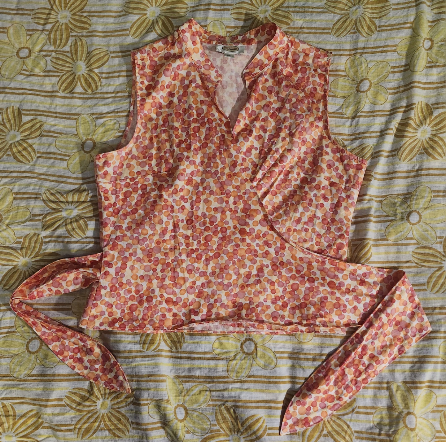 Orange and pink polka dot wrap top with adjustable tie