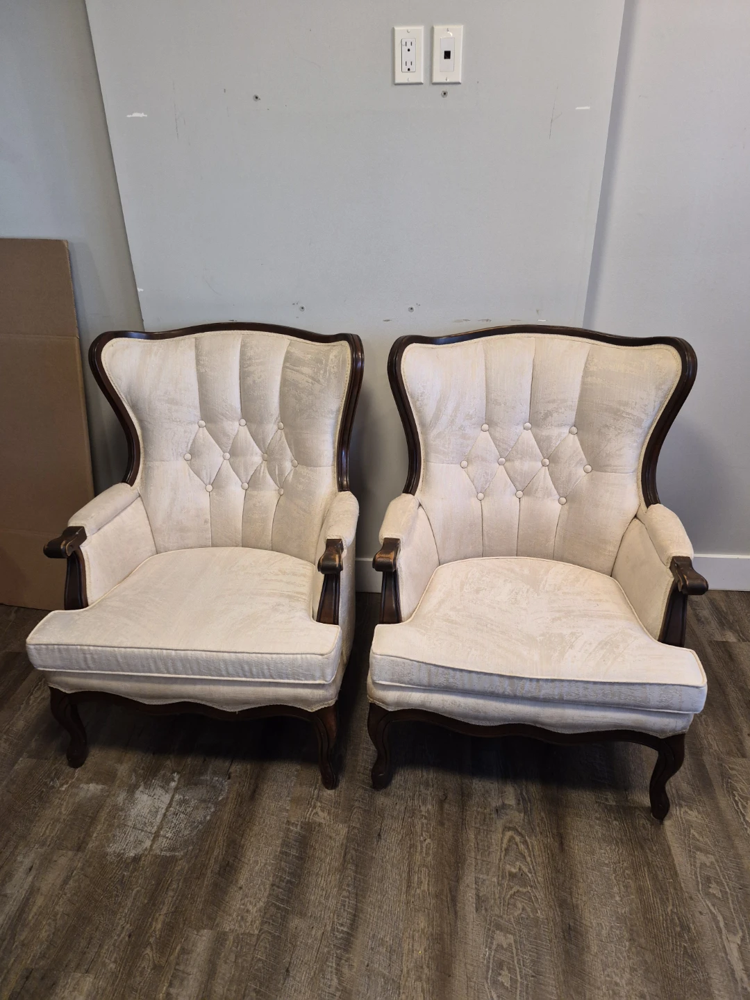 Pair of Cream Upholstered Wingback Chairs