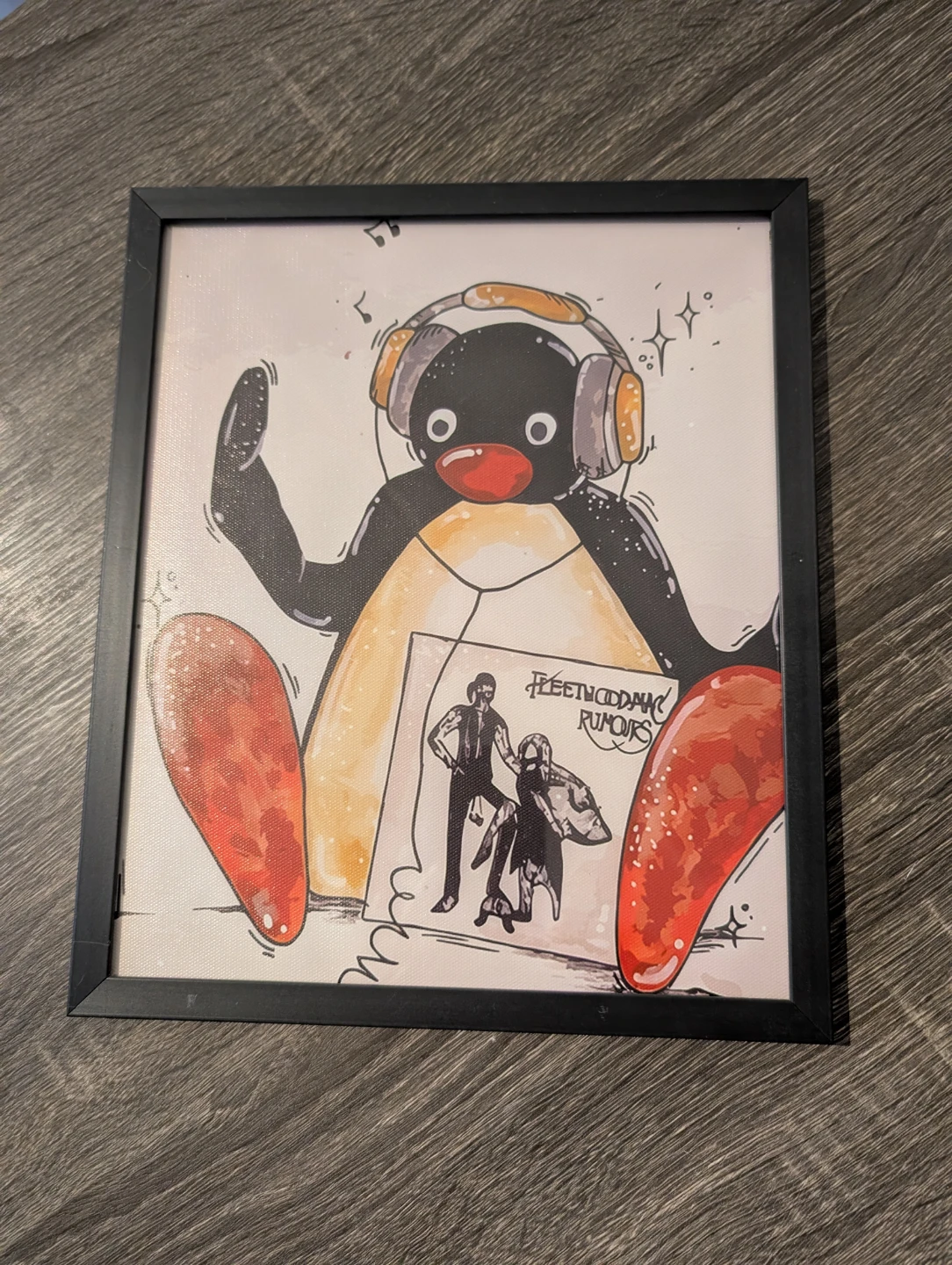 Framed Pingu print in black frame