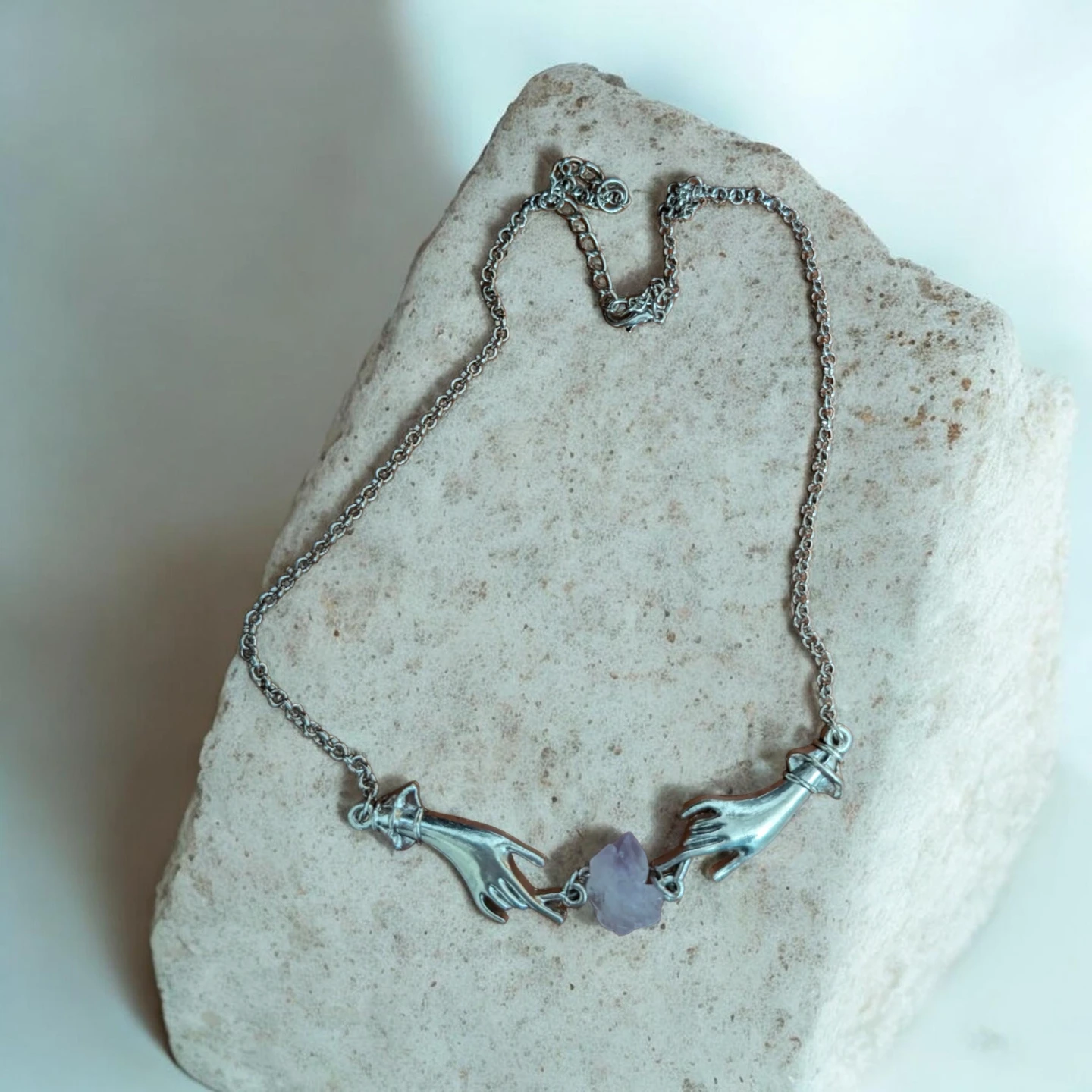 Hand Holding Crystal Pendant Necklace