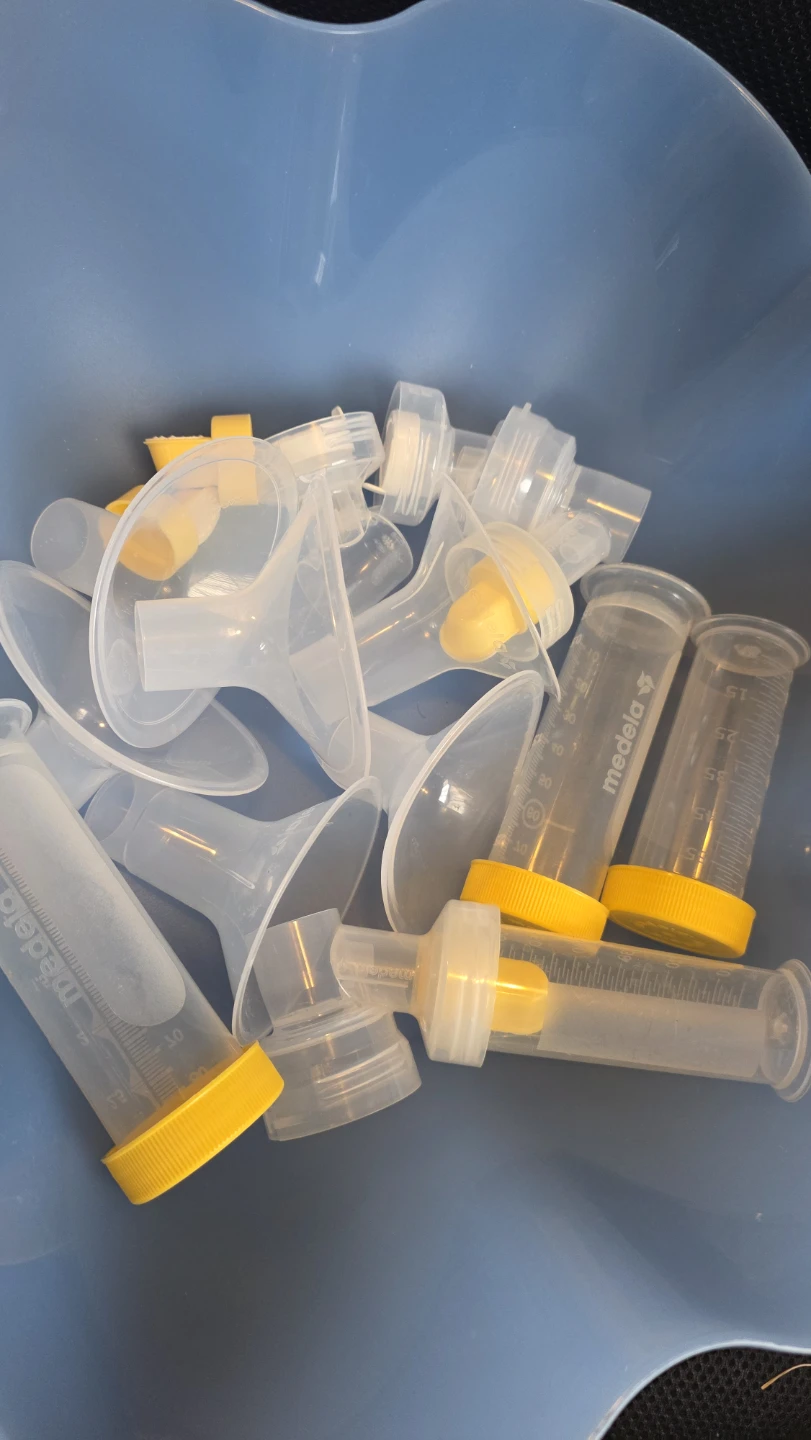 Medela Breast Pump Parts Collection and Tupperware bowl