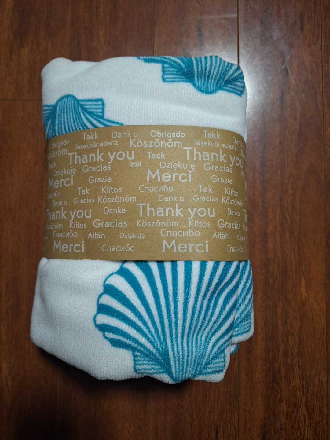 New white & blue seashell towel, still wrapped