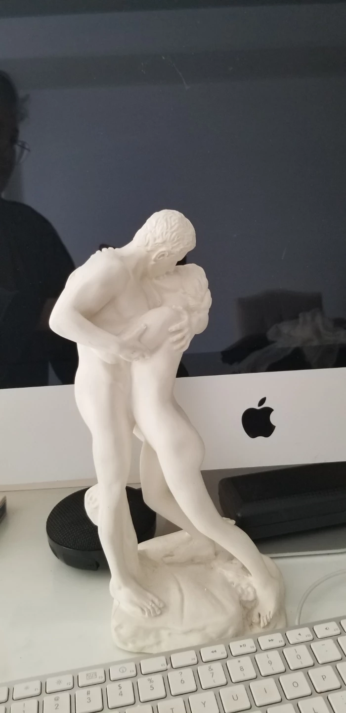 White Sculpture of Embracing Couple