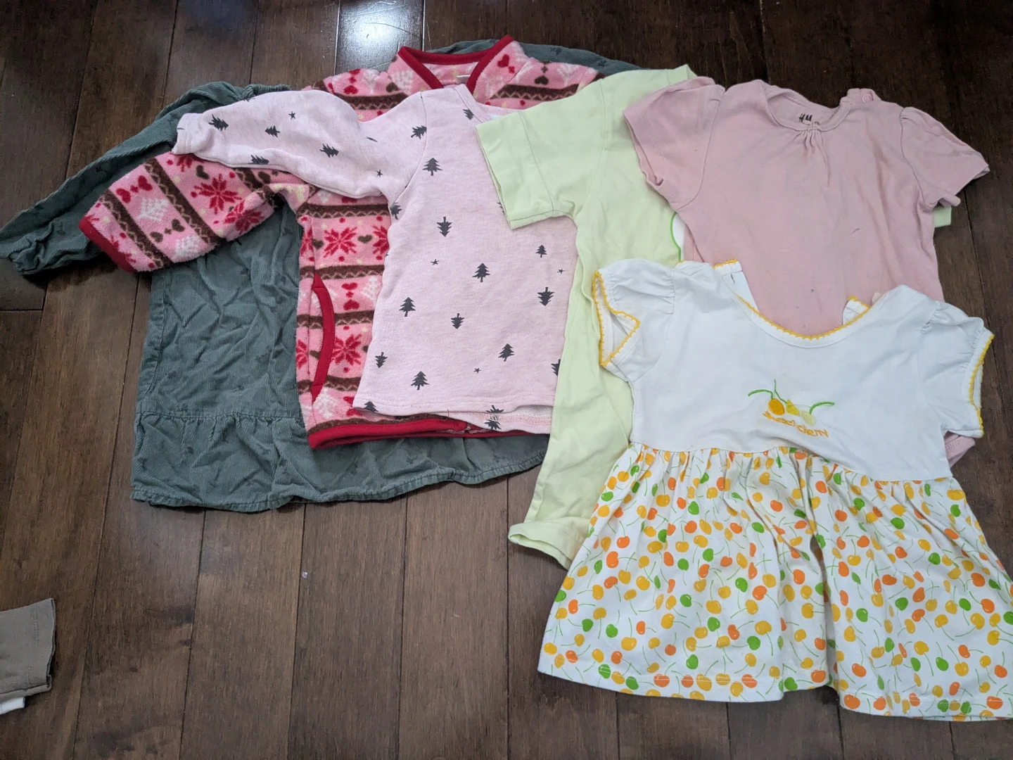 Baby clothes with some noticeable stains or signs of wear 12-18M