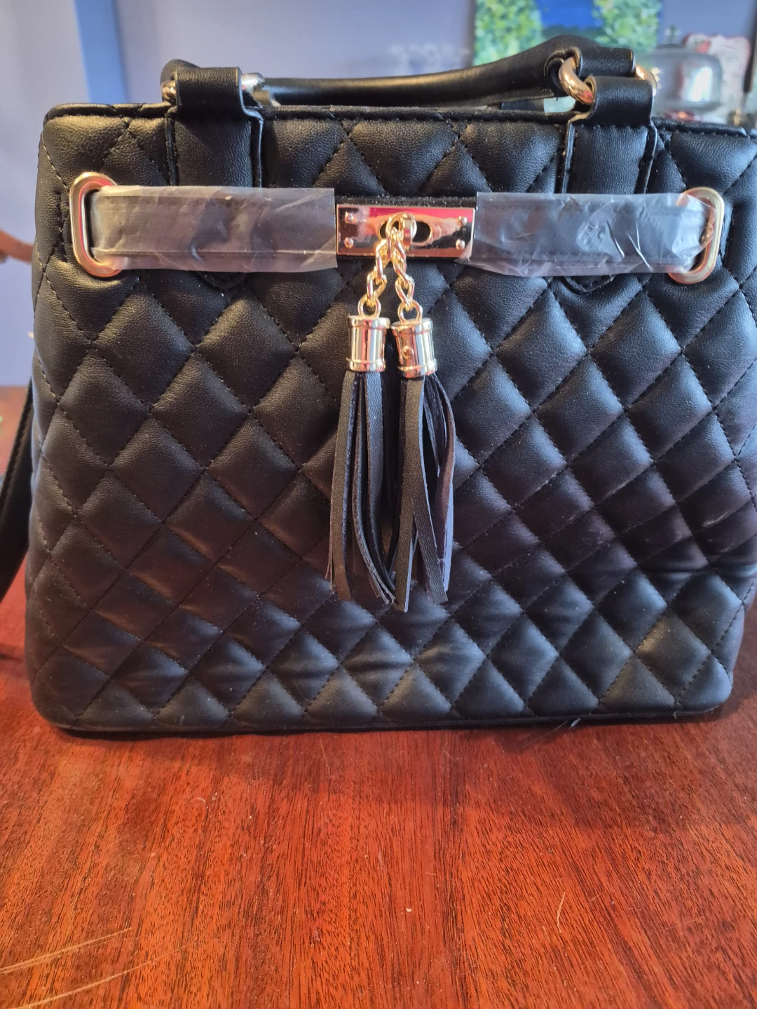 Quilted Black Handbag with Tassels