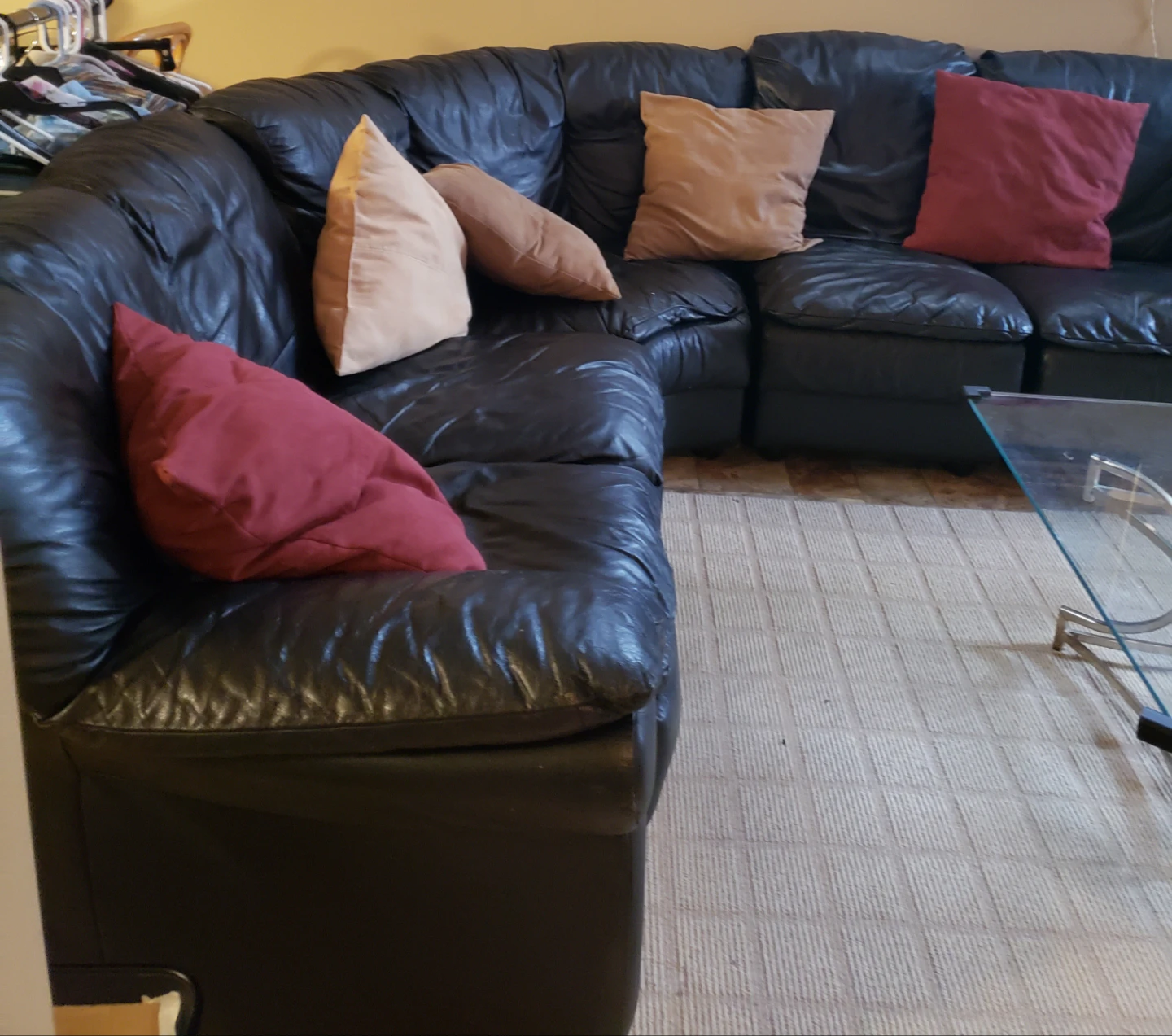 Black Leather Sectional Sofa with Pillows