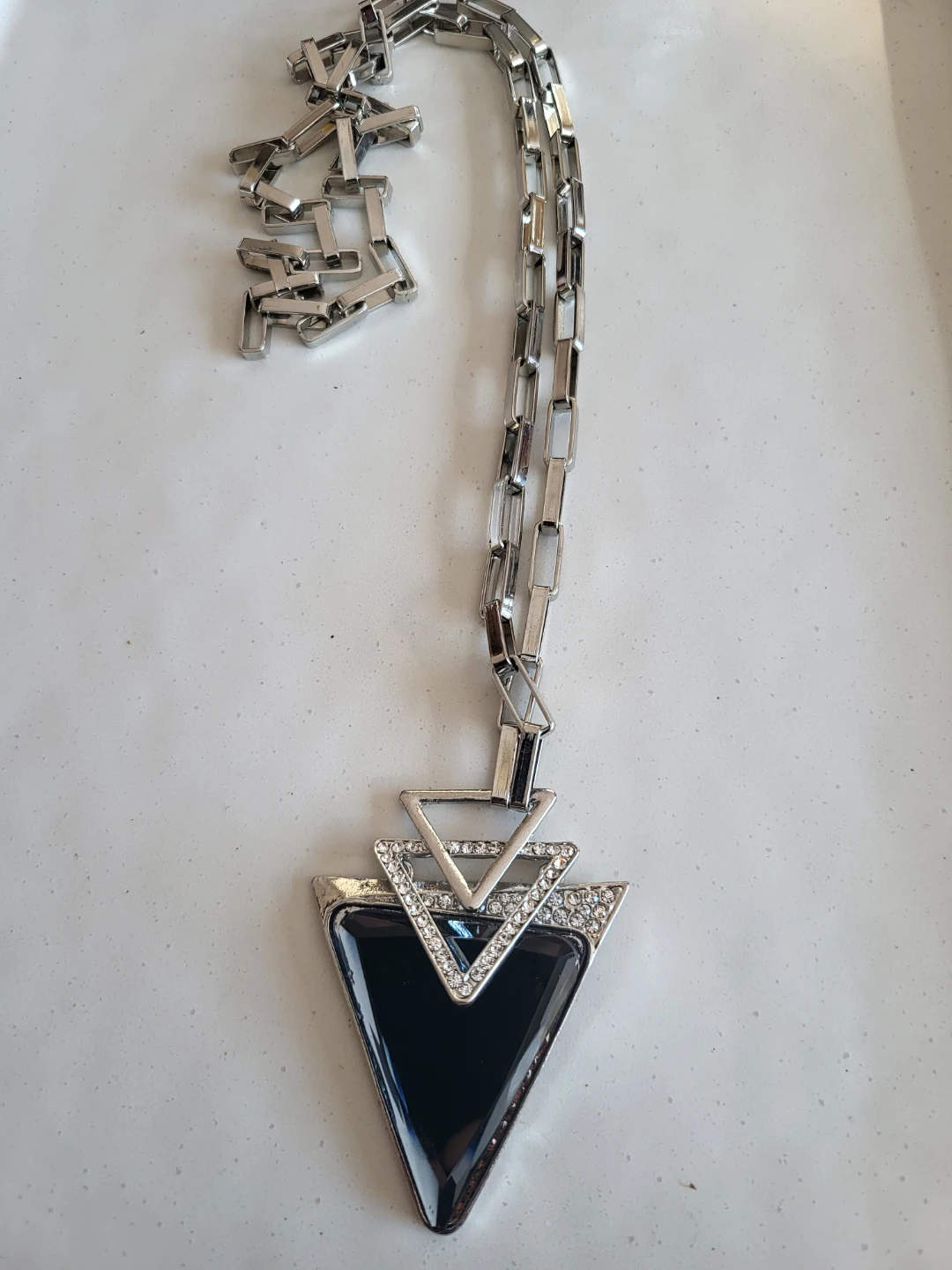 Silver tone geometric necklace with black stone and rhinestones