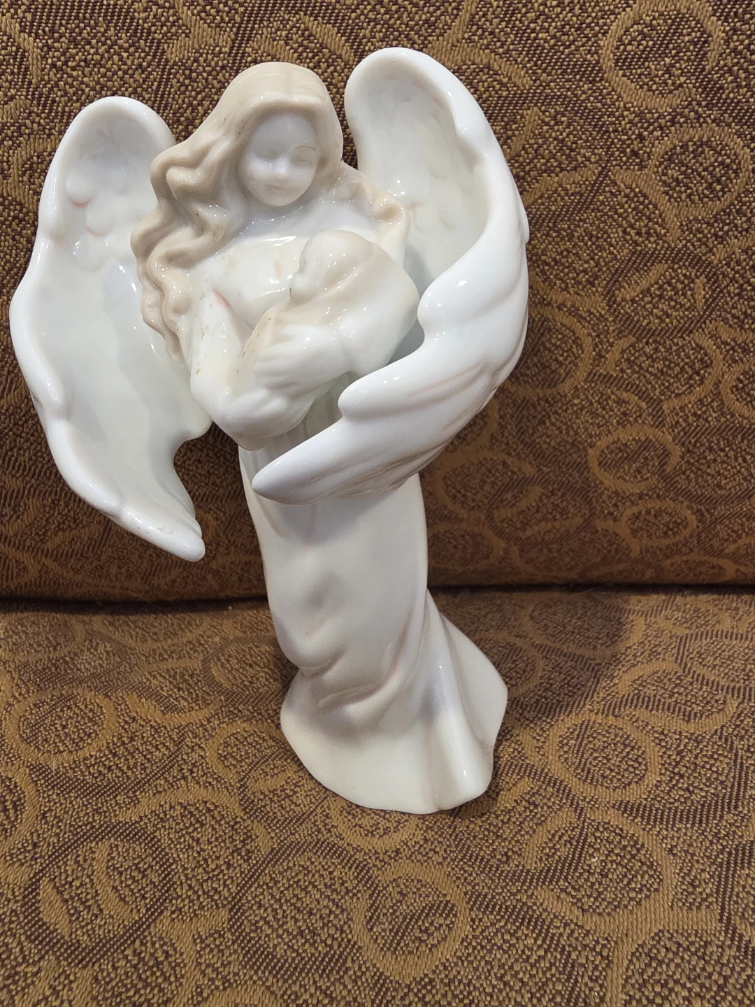 Angel Figurine Holding Baby