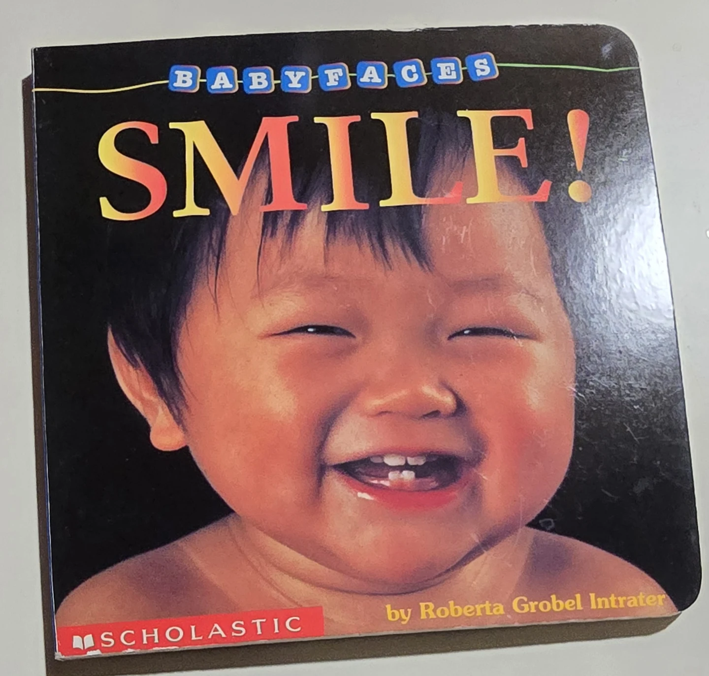 Baby Faces Smile! Board Book by Scholastic