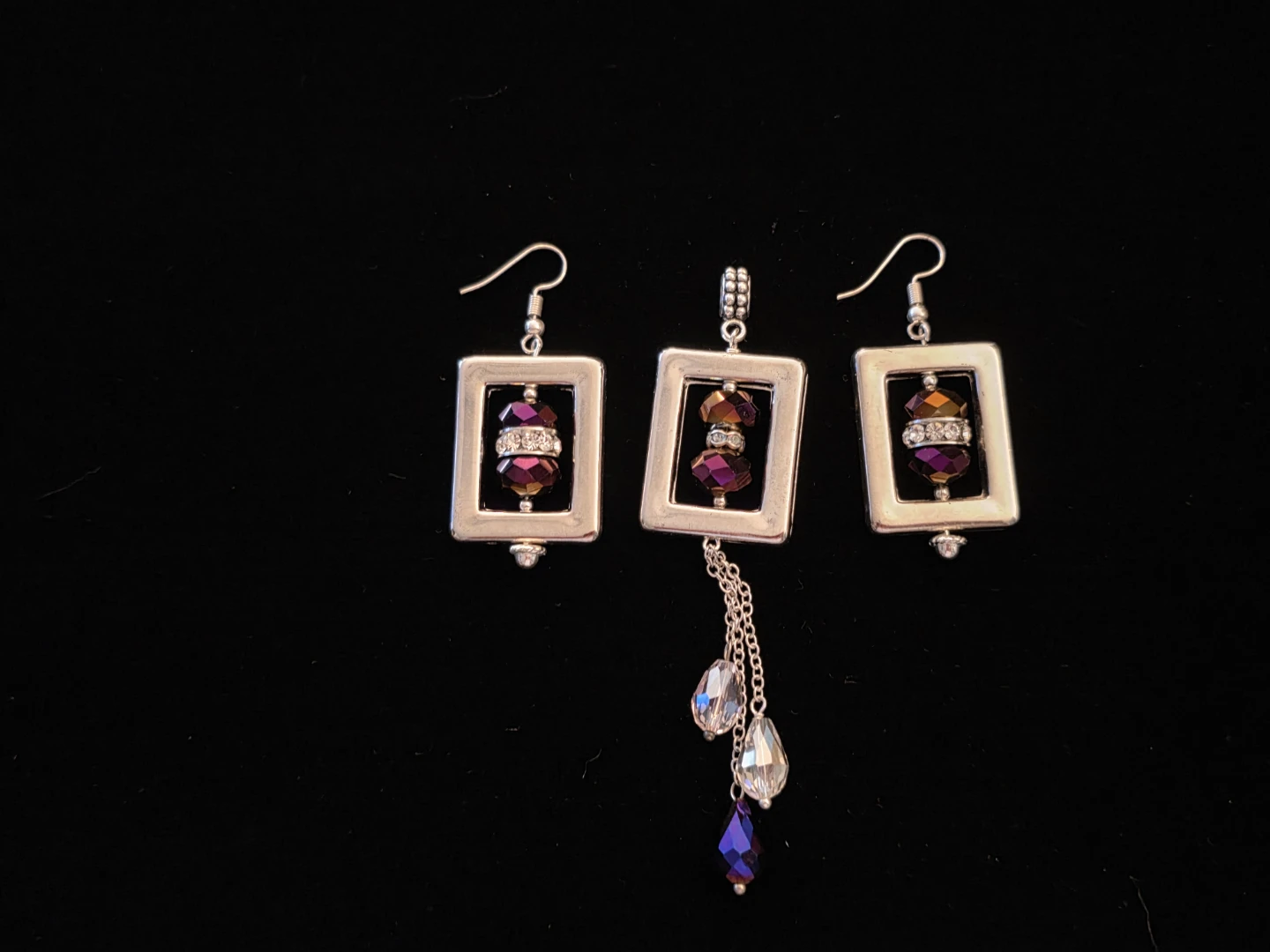 Silver tone dangle earrings and pendant set
