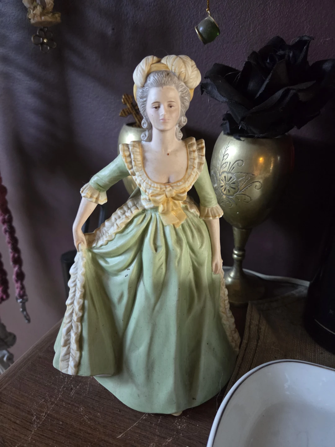 Figurine of a woman in a green dress