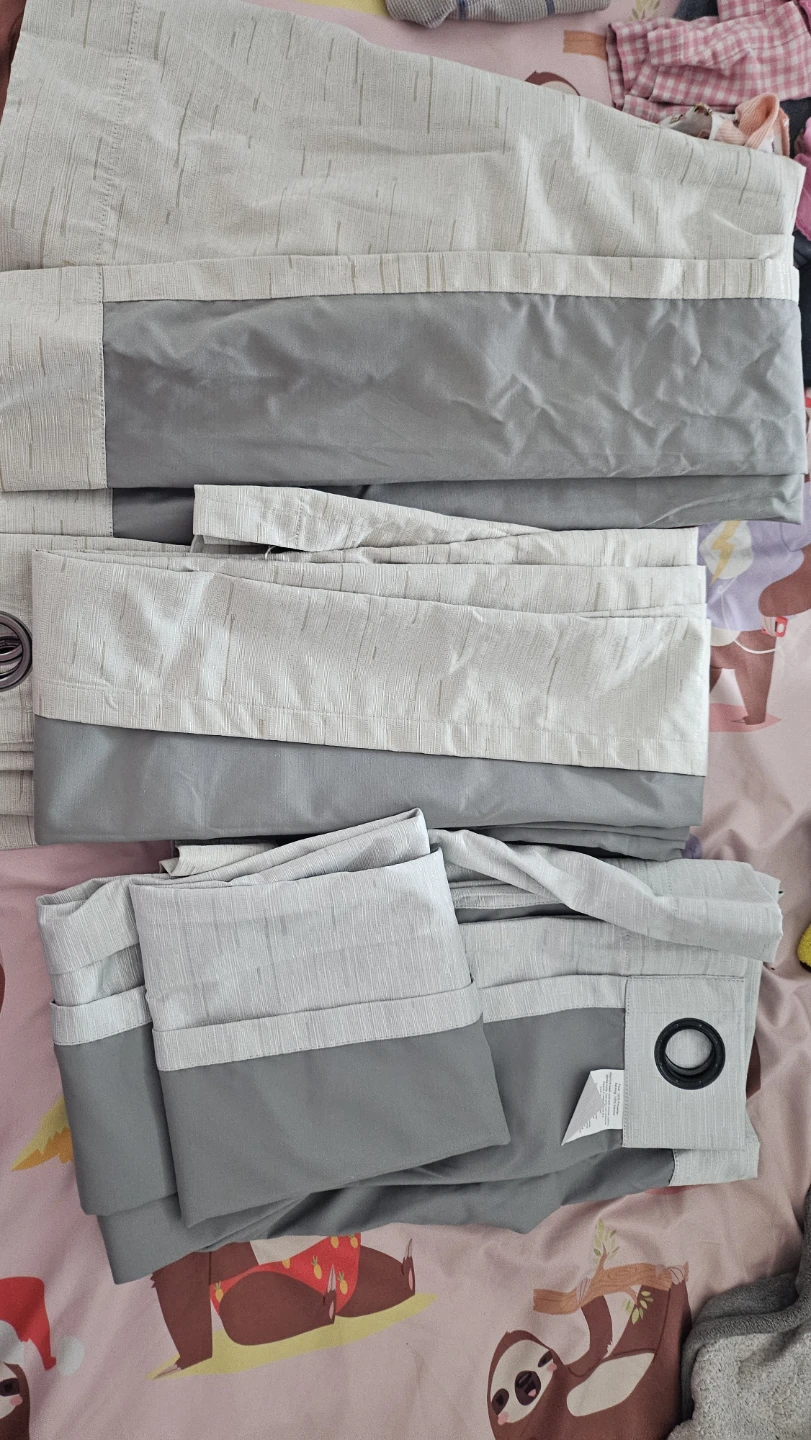 2 cream and 1 grey patterned blackout curtains