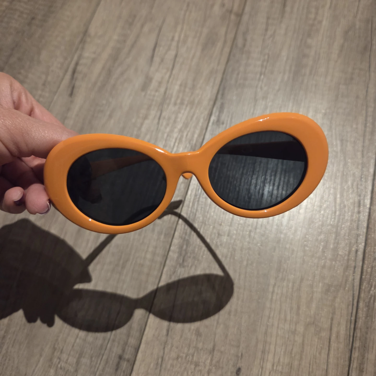 Orange oval sunglasses