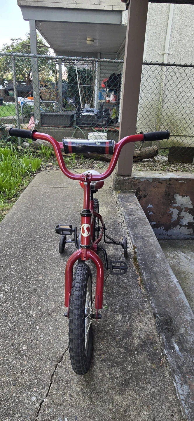 Red and black supercycle kids bike