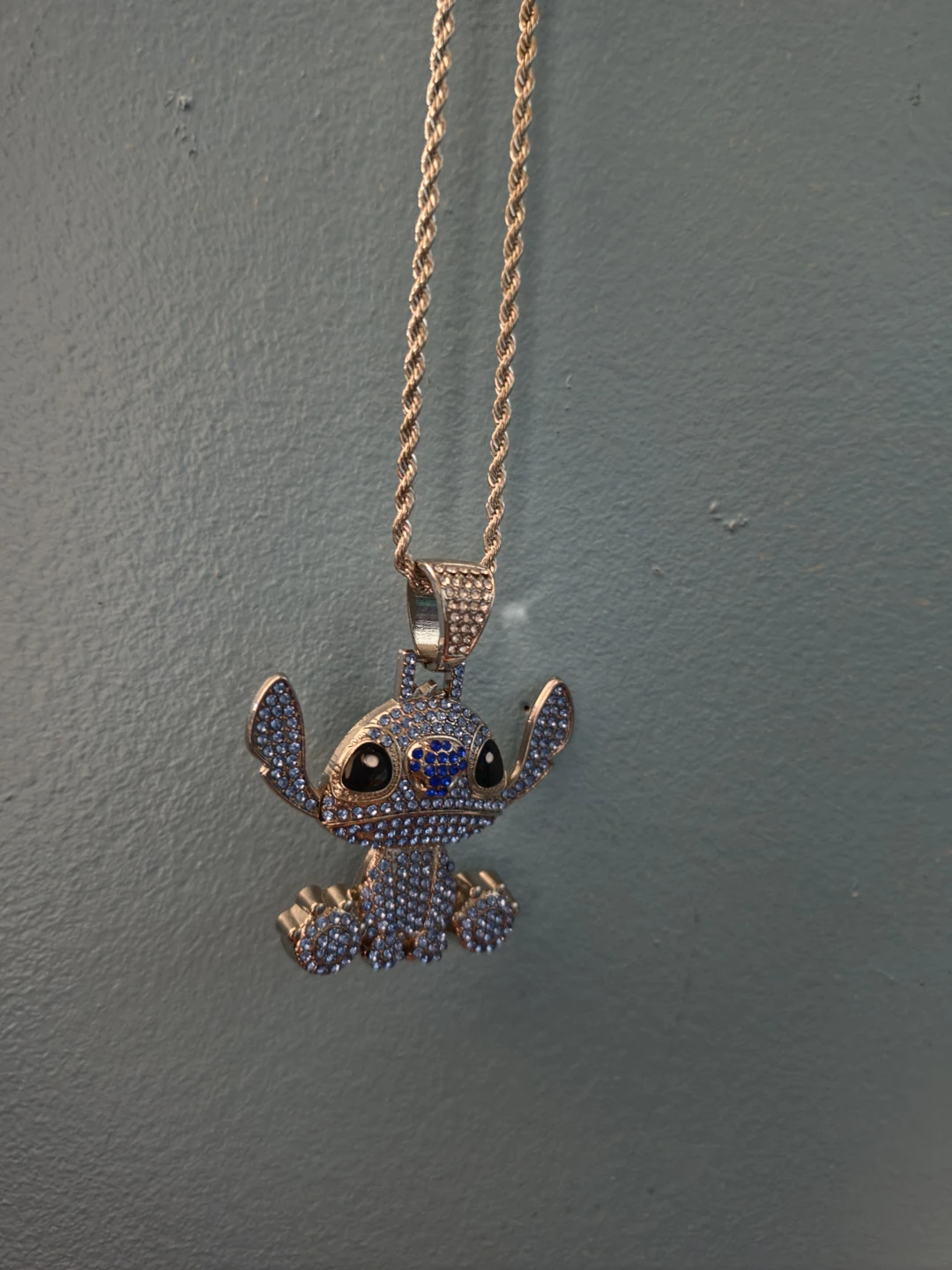 Gold-tone Stitch Pendant Necklace with Blue and Clear Crystals